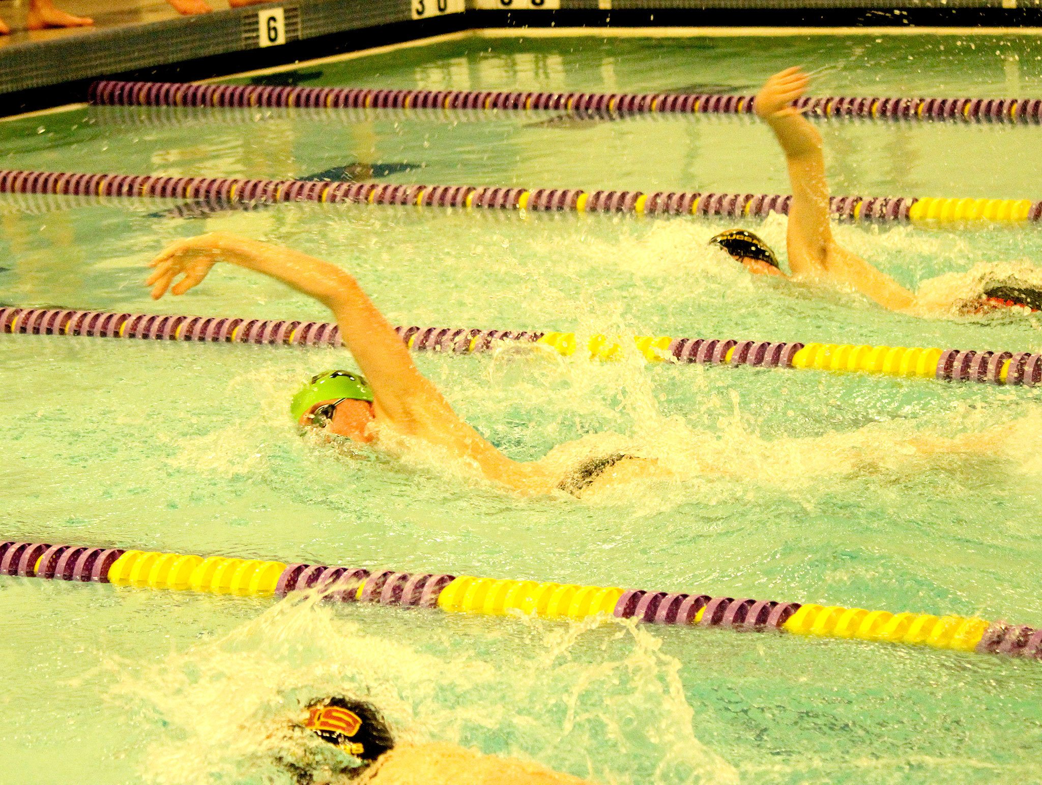 Patty Reifenstahl                                Port Angeles&rsquo; Tristin Butler (center) qualifies for state with a time of 5:03.81 in the 500 freestyle in a meet against Kingston.                                Patty Reifenstahl Port Angeles&rsquo; Tristin Butler (center) qualifies for state with a time of 5:03.81 in the 500 freestyle in a meet against Kingston.