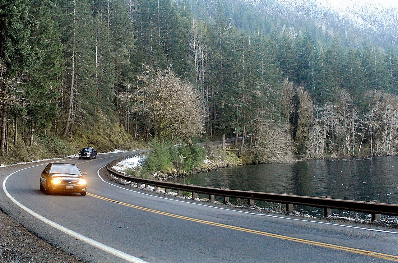 Traffic makes its way along U.S. Highway 101 as it winds around Lake Crescent in Olympic National Park west of Port Angeles. (Keith Thorpe/Peninsula Daily News)
