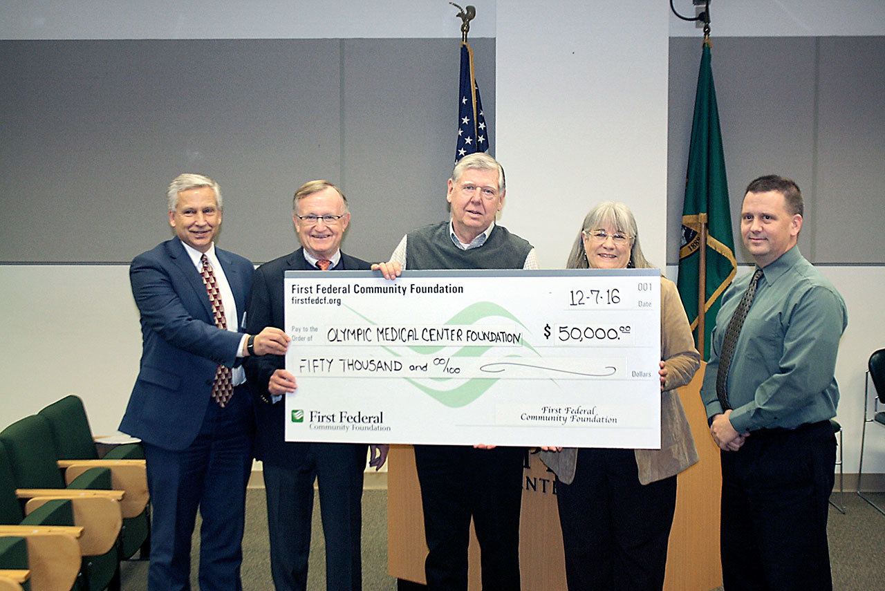 First Federal Community Foundation has donated $50,000 to the campaign to raise money for an expansion of the Olympic Medical Cancer Center. From left are Eric Lewis, CEO of Olympic Medical Center; Bruce Skinner, executive director of Olympic Medical Center Foundation; Dave Flodstrom, chairman of First Federal Foundation Board; Karen McCormick, executive director of First Federal Foundation; and John Nutter, chairman of the Olympic Medical Center commission.