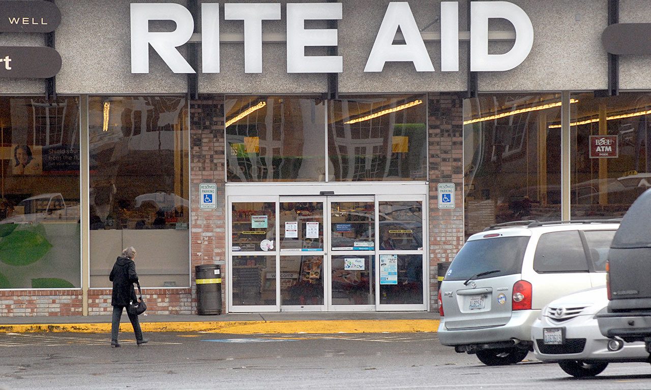 A customer approches the door to the Rite Aid store on South Lincoln Street in Port Angeles on Thursday. (Keith Thorpe/Peninsula Daily News)