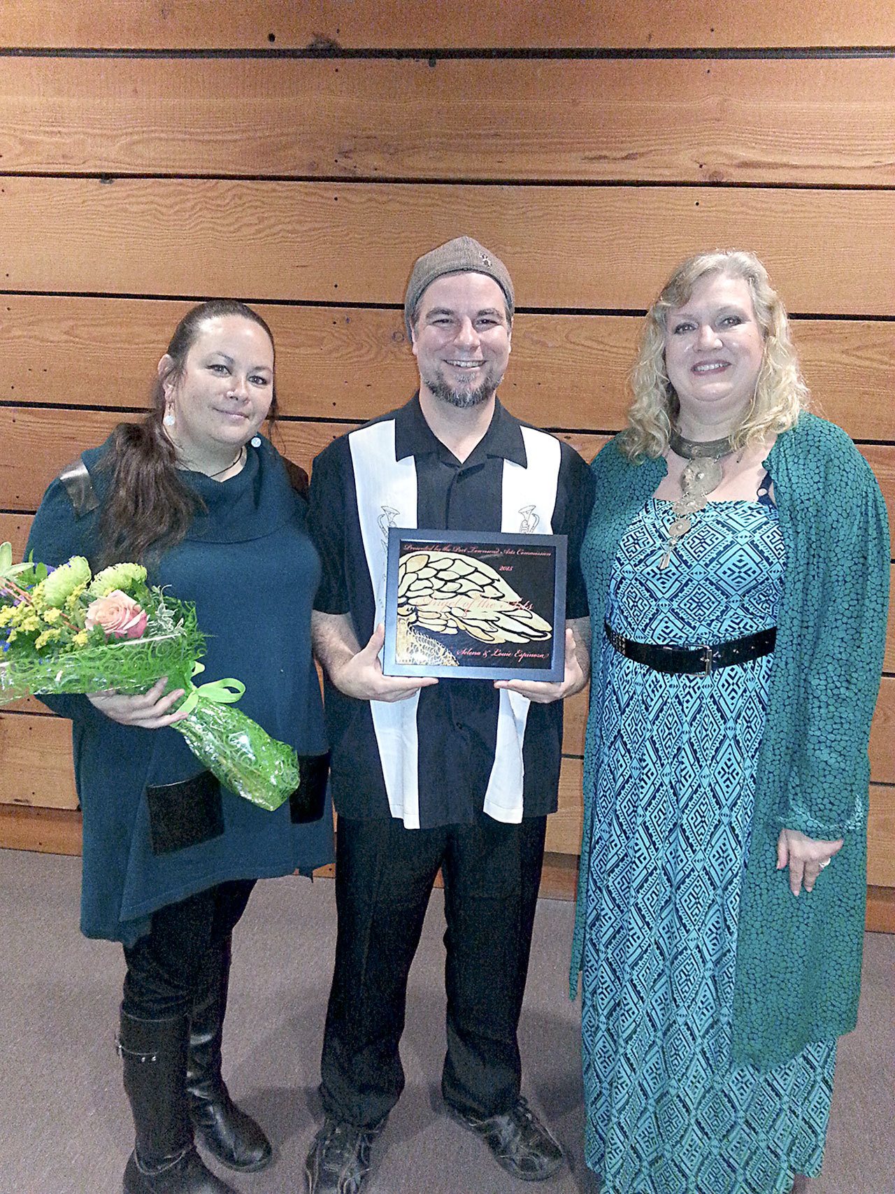 Last year’s Angel of the Arts award recipients Selena and Louie Espinoza pose with their award and Arts Commission member Lisa Wentworth. (Port Townsend Arts Commission)