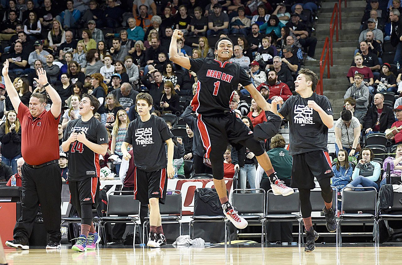 The Associated Press Neah Bay’s Rweha Munyagi (1) leaps into the air in celebration after his team defeated Almira/Coulee-Hartline during the WIAA Class 1B state championship basketball game on Saturday, March 5, 2016 in Spokane.