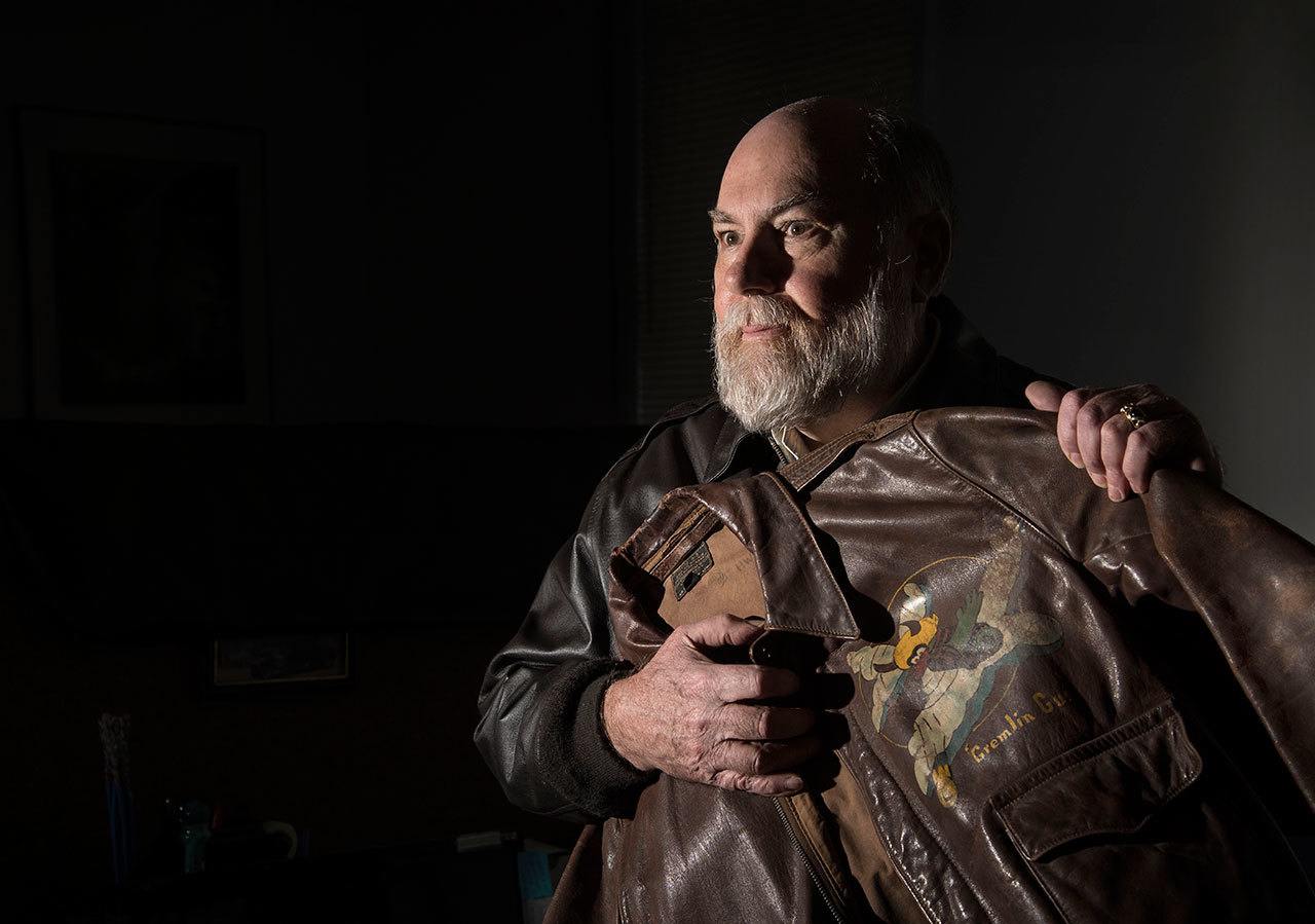 Greg Staples holds his father’s vintage flight jacket in his office in north Spokane. Maj. Donald Staples died in a B-52 crash Sept. 8, 1958, near Fairchild Air Force Base. (Dan Pelle/The Spokesman-Review via AP)