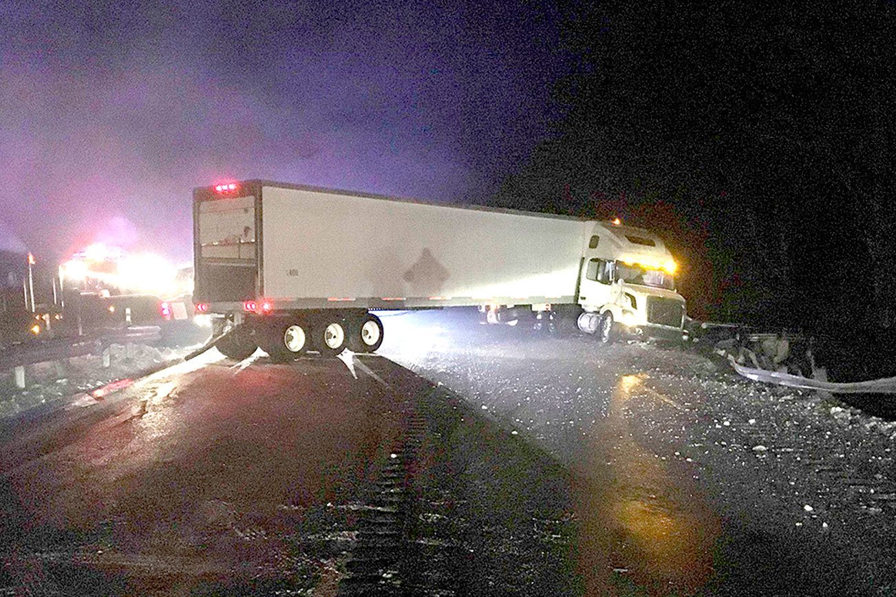 Tractor-trailer wrecks on icy road near Elwha River bridge