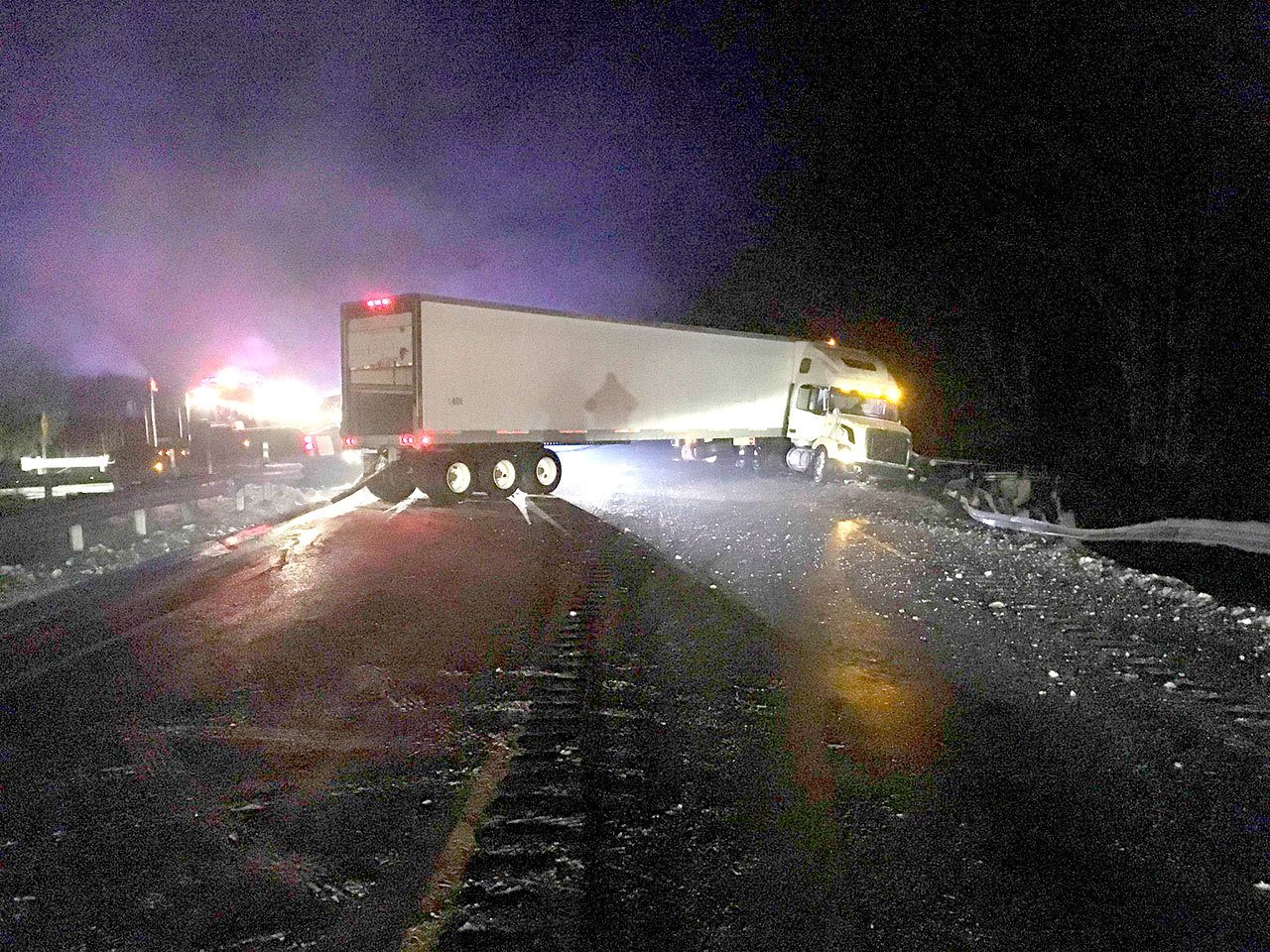 A jack-knifed tractor-trailer blocked U.S. Highway 101 at milepost 239 near the Elwha River for several hours Monday morning. (Russ Winger/Washington State Patrol)