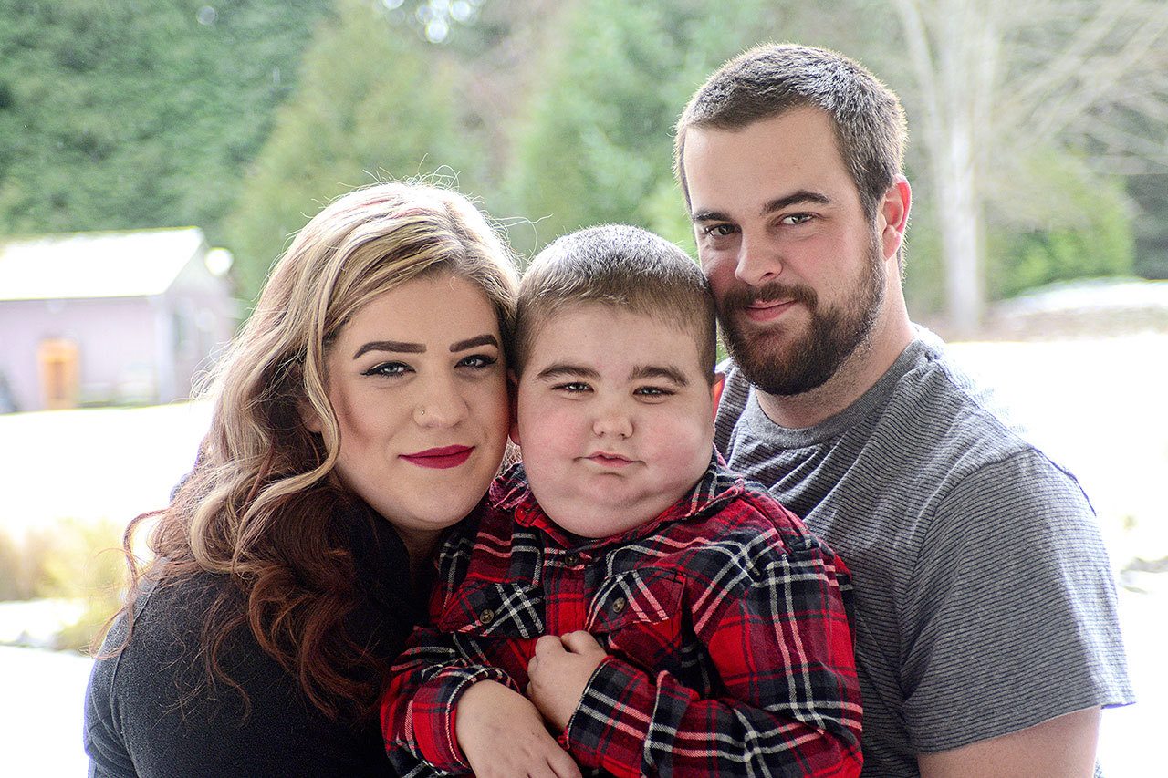 Chasia and George Bailey of Sequim with their 5-year-old son, Patrick, who was recently diagnosed with systemic juvenile idiopathic arthritis. (Jesse Major/Peninsula Daily News)