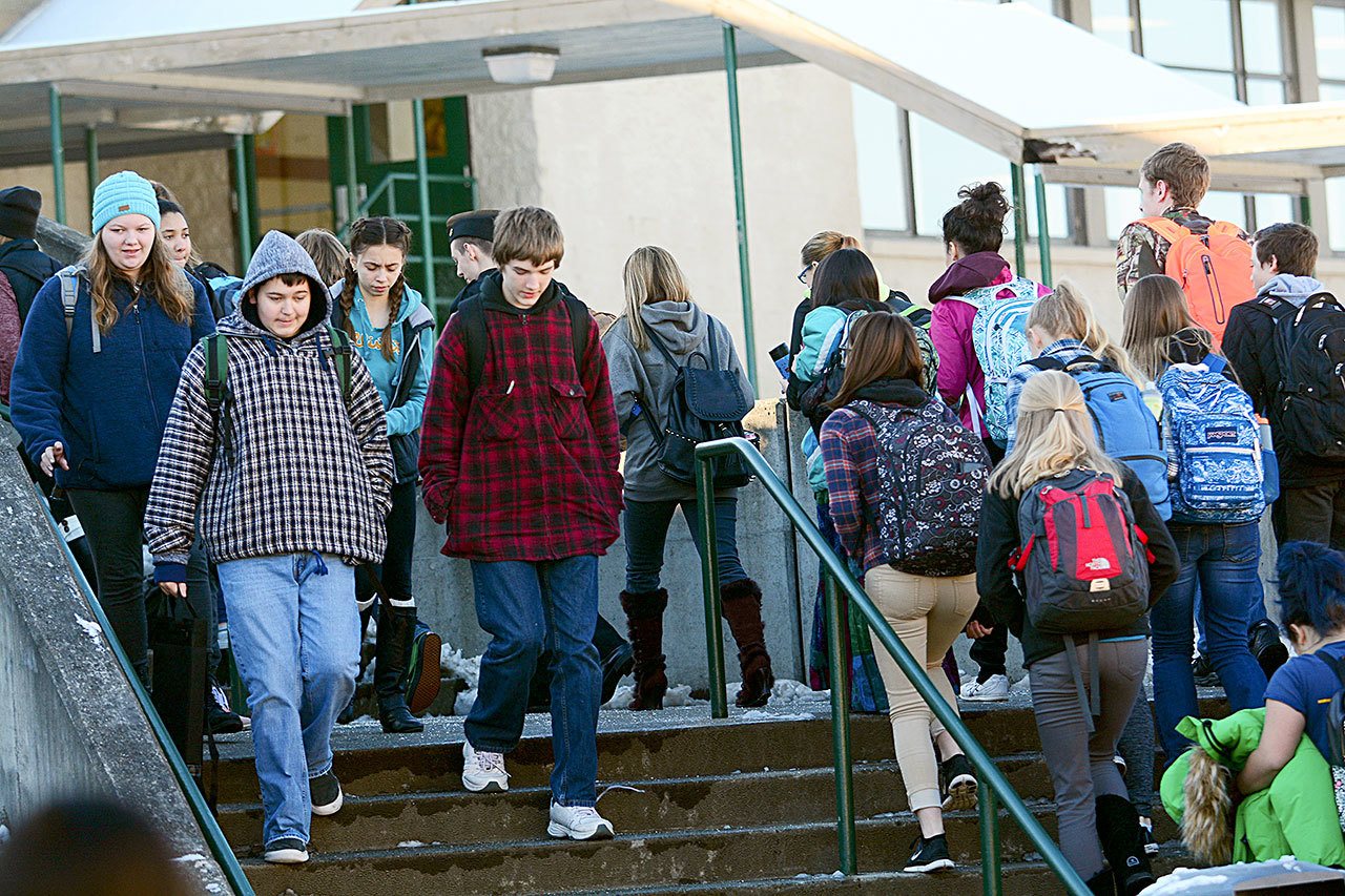 Port Angeles High School students walk between classes Wednesday morning. The Port Angeles School District is asking voters to approve a levy that would fund 22 percent of the district’s daily operating budget. (Jesse Major/Peninsula Daily News)