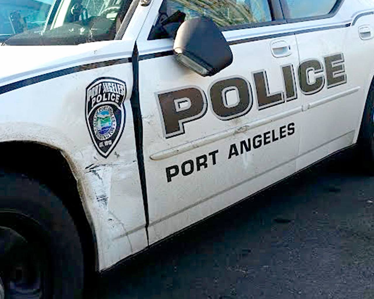 Port Angeles Police Officer T.J. Mueller’s patrol car was allegedly rammed by a Port Angeles man who police say led them on a high-speed chase through the city. (Port Angles Police Department)