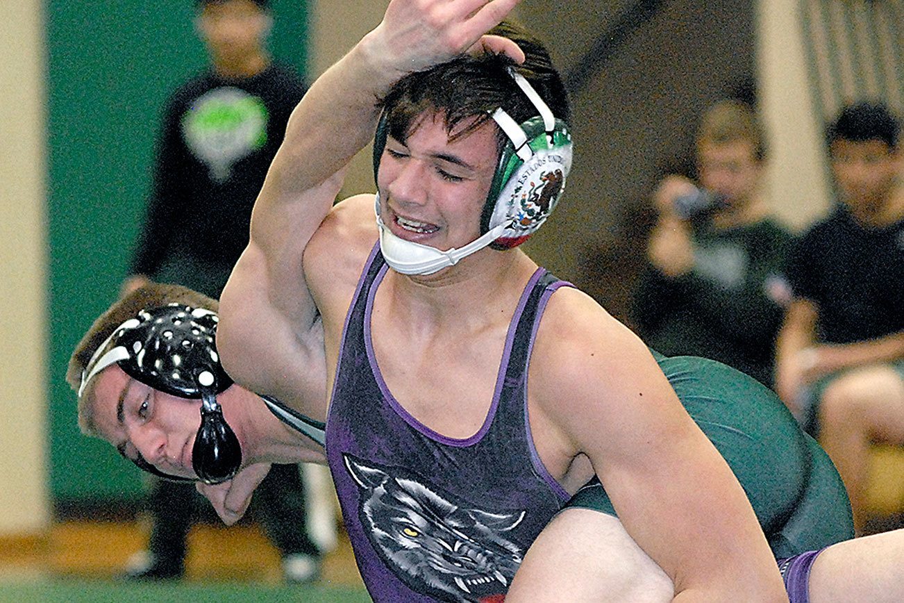 WRESTLING: Sequim grapplers win the Battle of the Axe