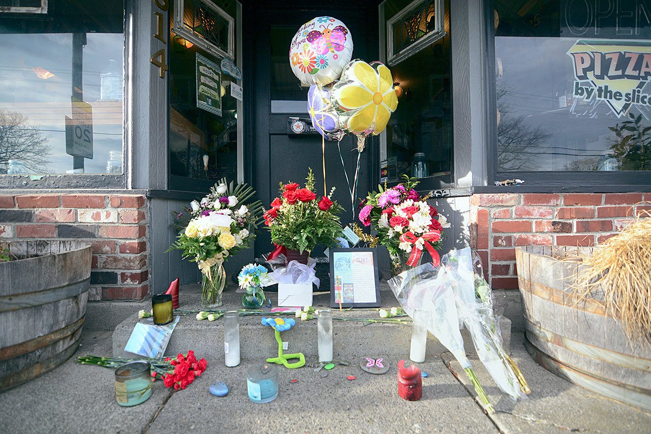 A memorial for Clint Darrow, who was shot and killed in his Port Angeles home last week, continued to grow at Van Goes Gourmet Pizza & Mexican eatery on Monday. (Jesse Major/Peninsula Daily News)