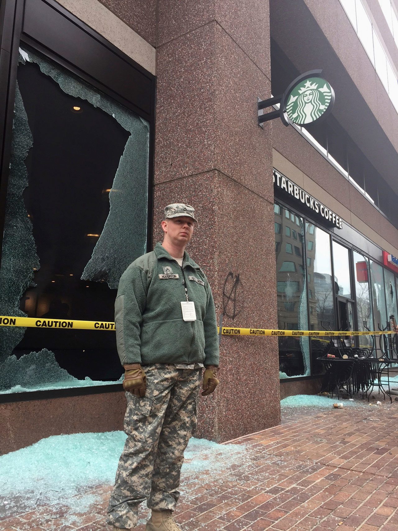 Tape closes off broken windows at businesses in Washington, D.C., after a confrontation with protestors blocks from President Donald Trump’s inauguration. (The Associated Press)