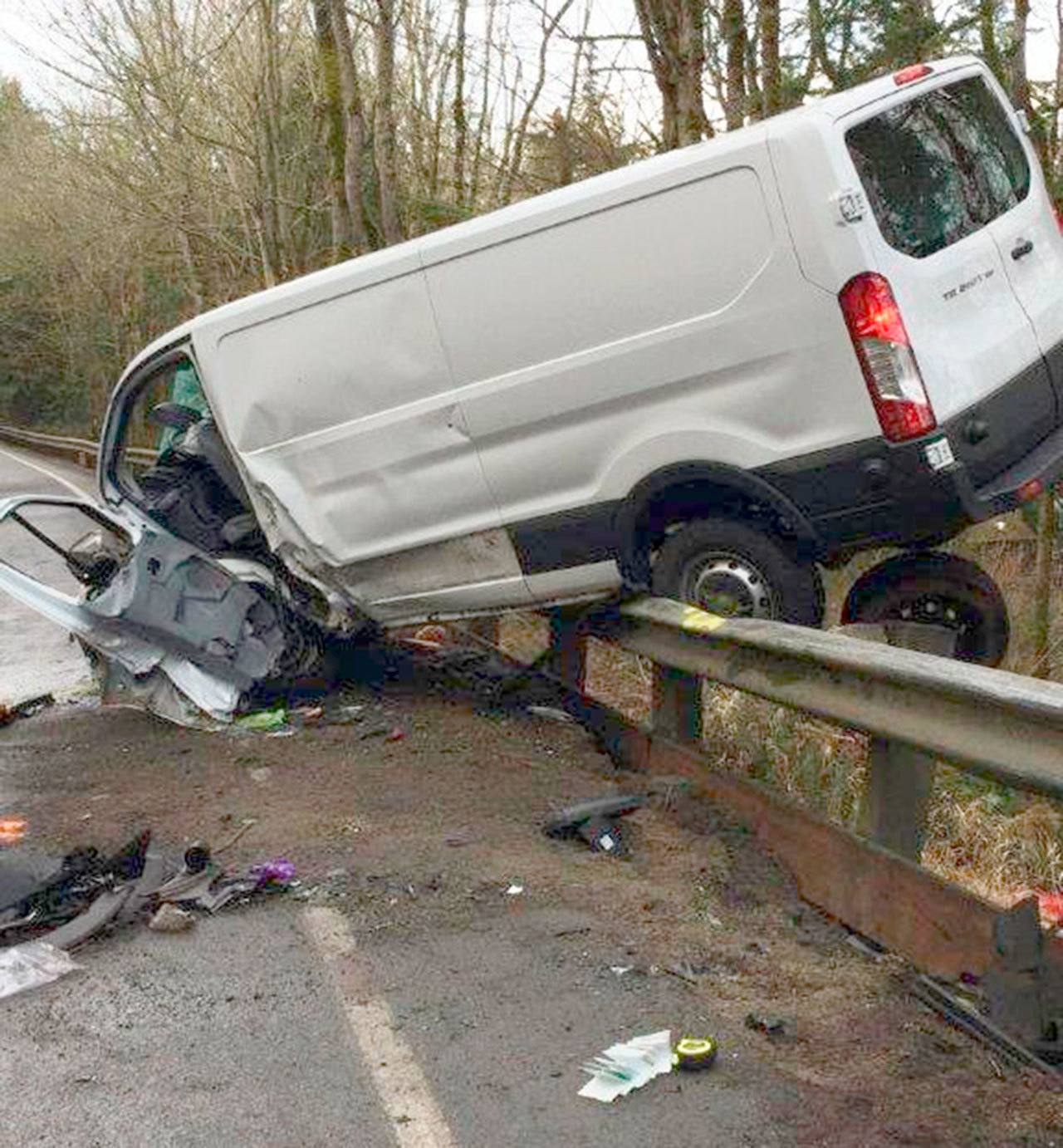 This white minivan ended up suspended on a guardrail following a wreck on state Highway 20.