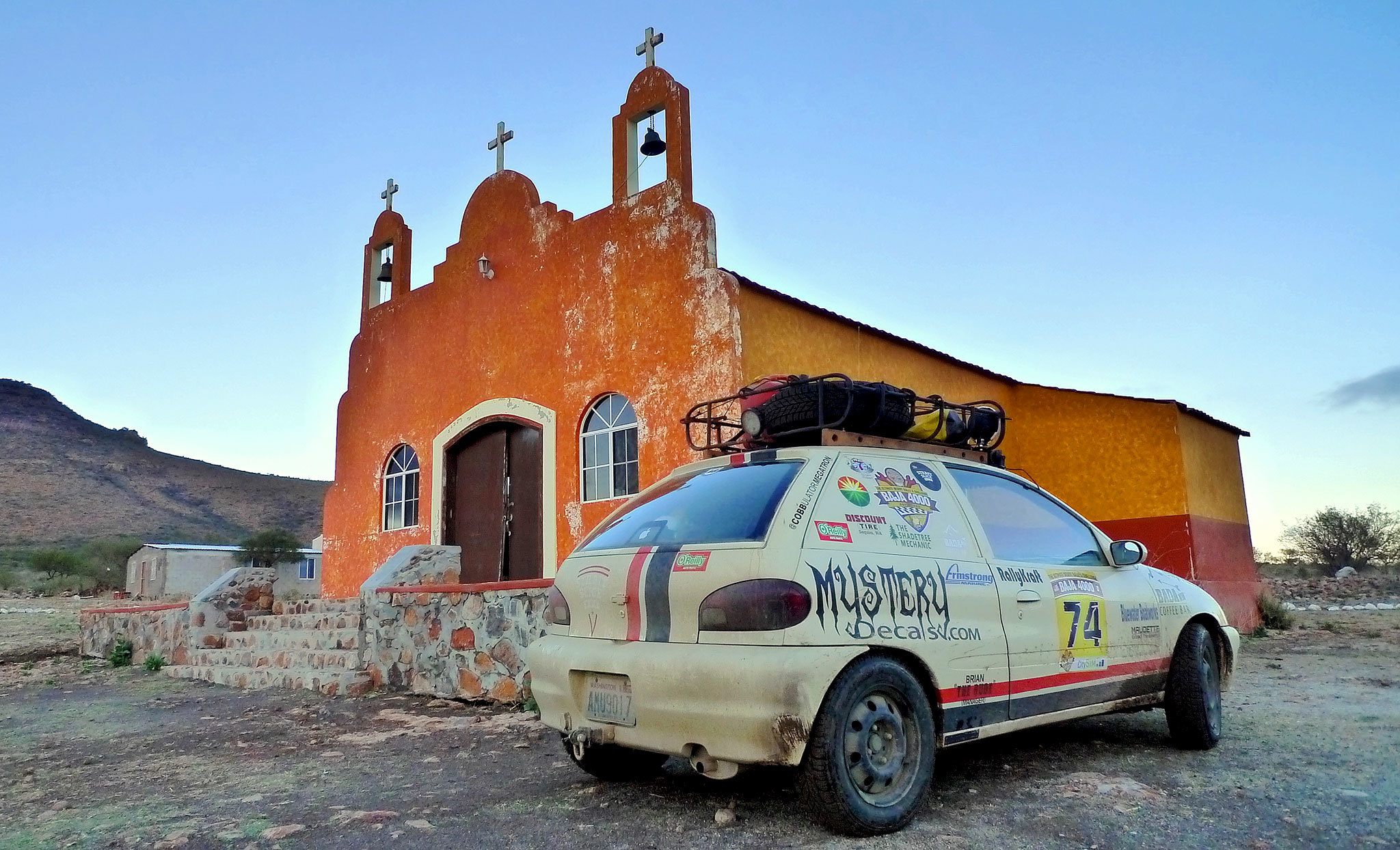 The Port Angeles team of Andy Audette and Nason Beckett and their 2000 Chevy Metro “Pepito” make a stop at an old mission at Sierrade San Francisco in the mountains of Baja California during the Baja 4000 Race.