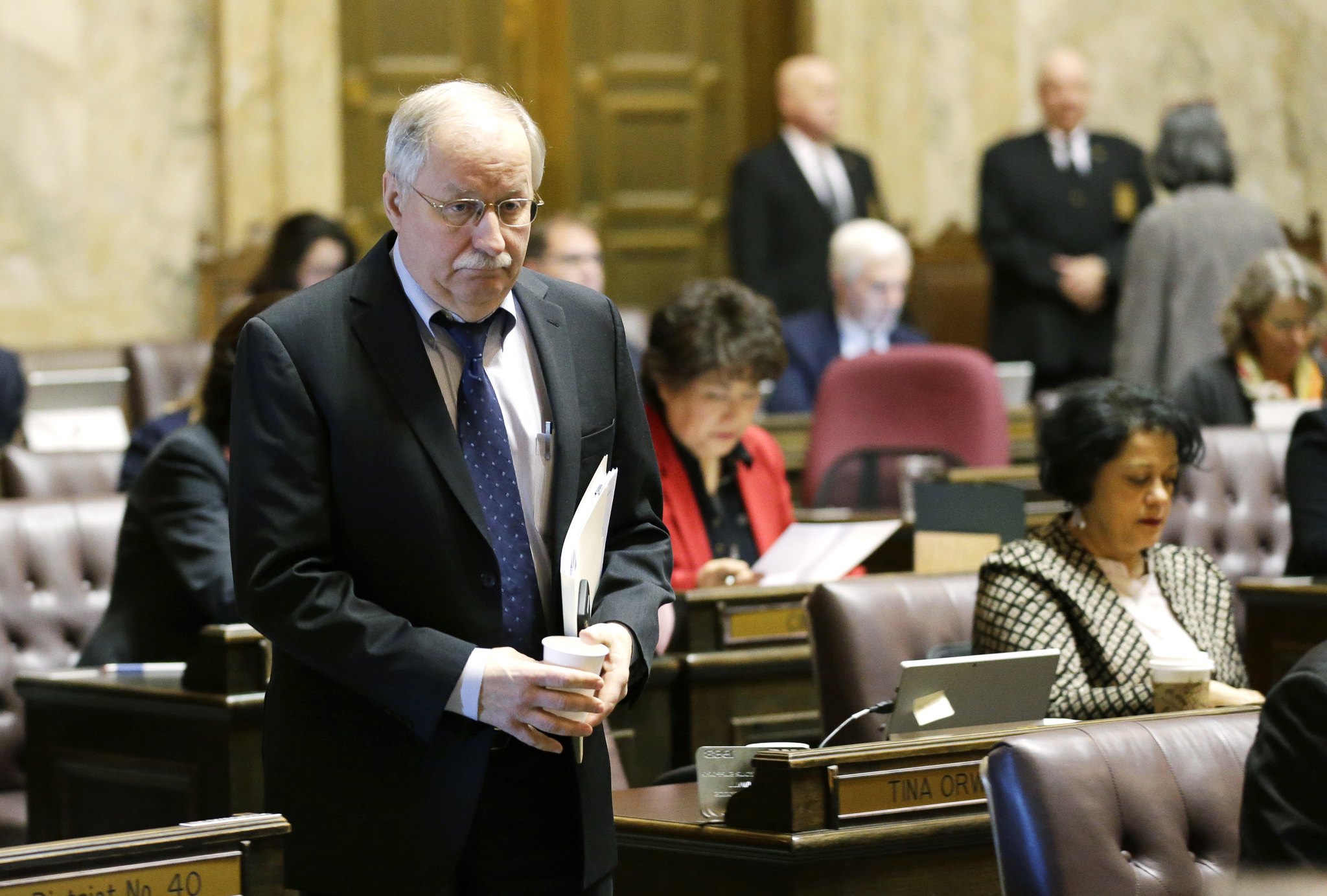 House Speaker Frank Chopp, D-Seattle, walks on the state House floor on Monday at the Capitol in Olympia. (Ted S. Warren/The Associated Press)