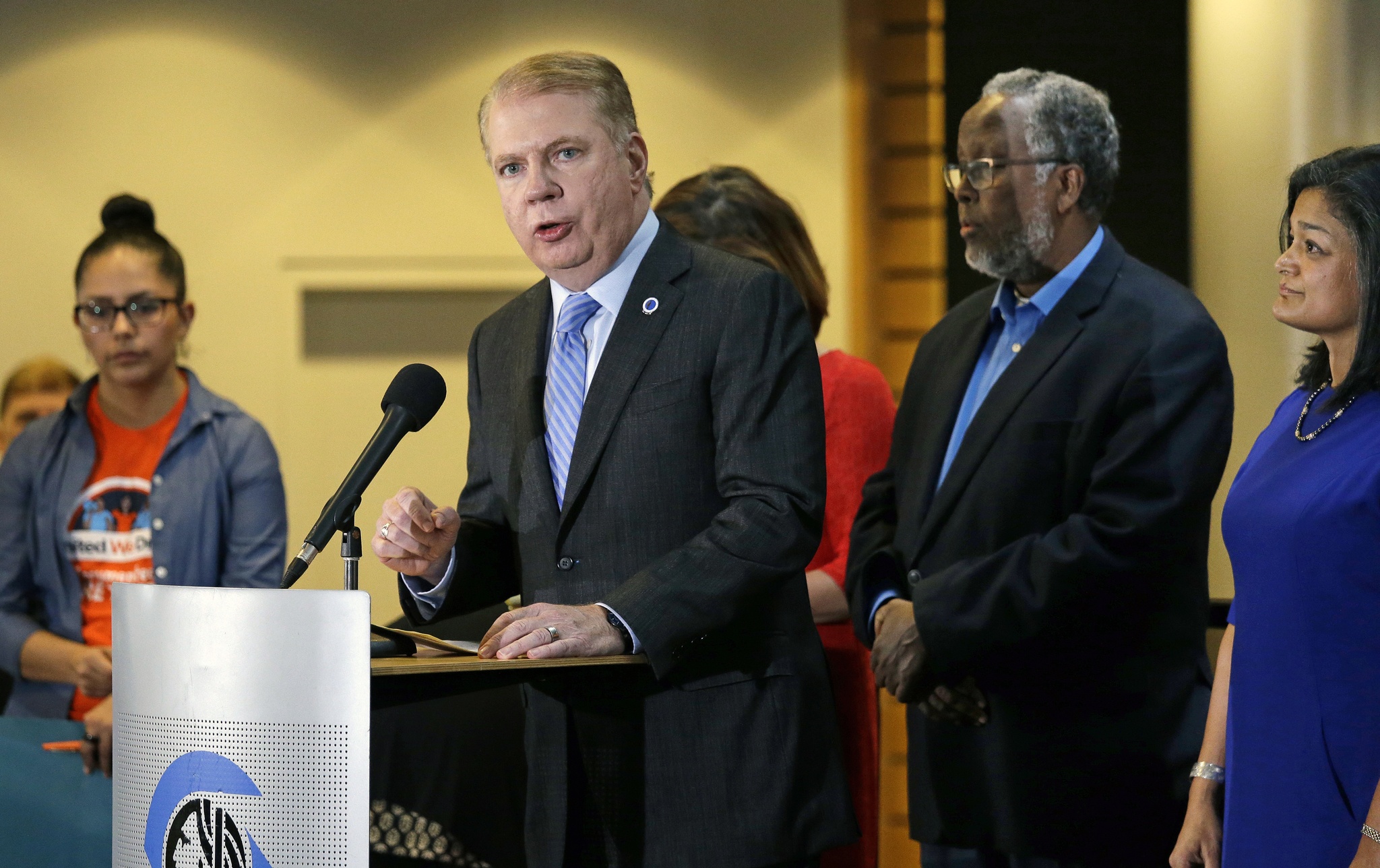 In this Nov. 9 photo, Seattle Mayor Ed Murray, second from left, speaks at a post-election event of elected officials and community leaders at City Hall in Seattle. (Elaine Thompson/The Associated Press)