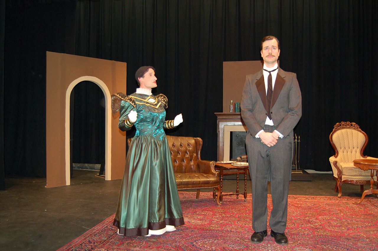 Erin Hawkins/Olympic Peninsula News Group                                Actors Josh Sutcliffe, left, and Randy Powell act out a scene from the witty play “The Importance of Being Earnest.” The show runs Jan. 27 to Feb. 12 at Olympic Theatre Arts.                                Actors Josh Sutcliffe, left, and Randy Powell act out a scene from the witty play “The Importance of Being Earnest.” The show runs Jan. 27-Feb. 12 at Olympic Theatre Arts in Sequim. (Erin Hawkins/Olympic Peninsula News Group)
