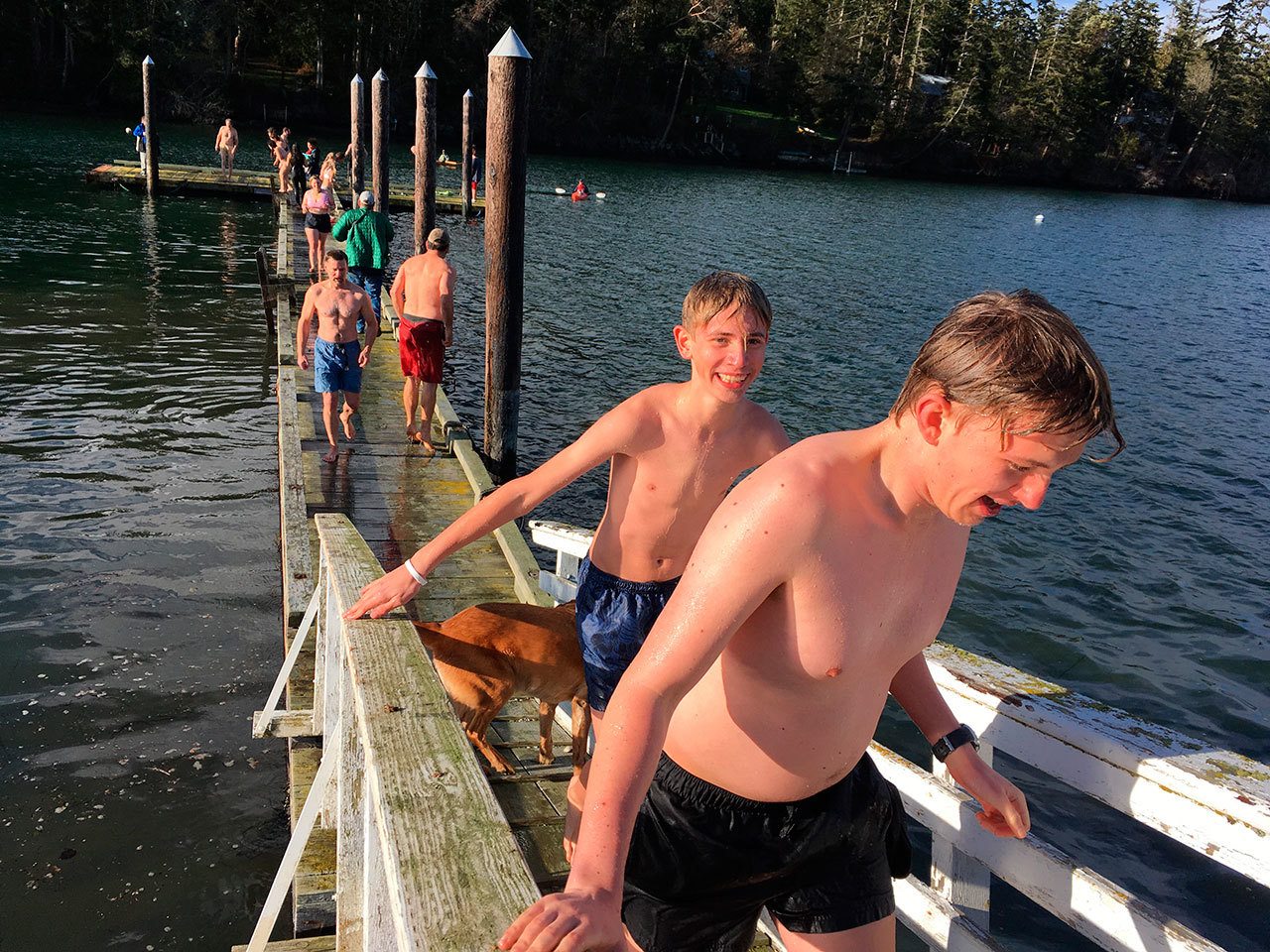 Brave people of all ages took on the new year with a swim off Marrowstone Island in the annual polar plunge on Sunday. (Cydney McFarland/Peninsula Daily News)