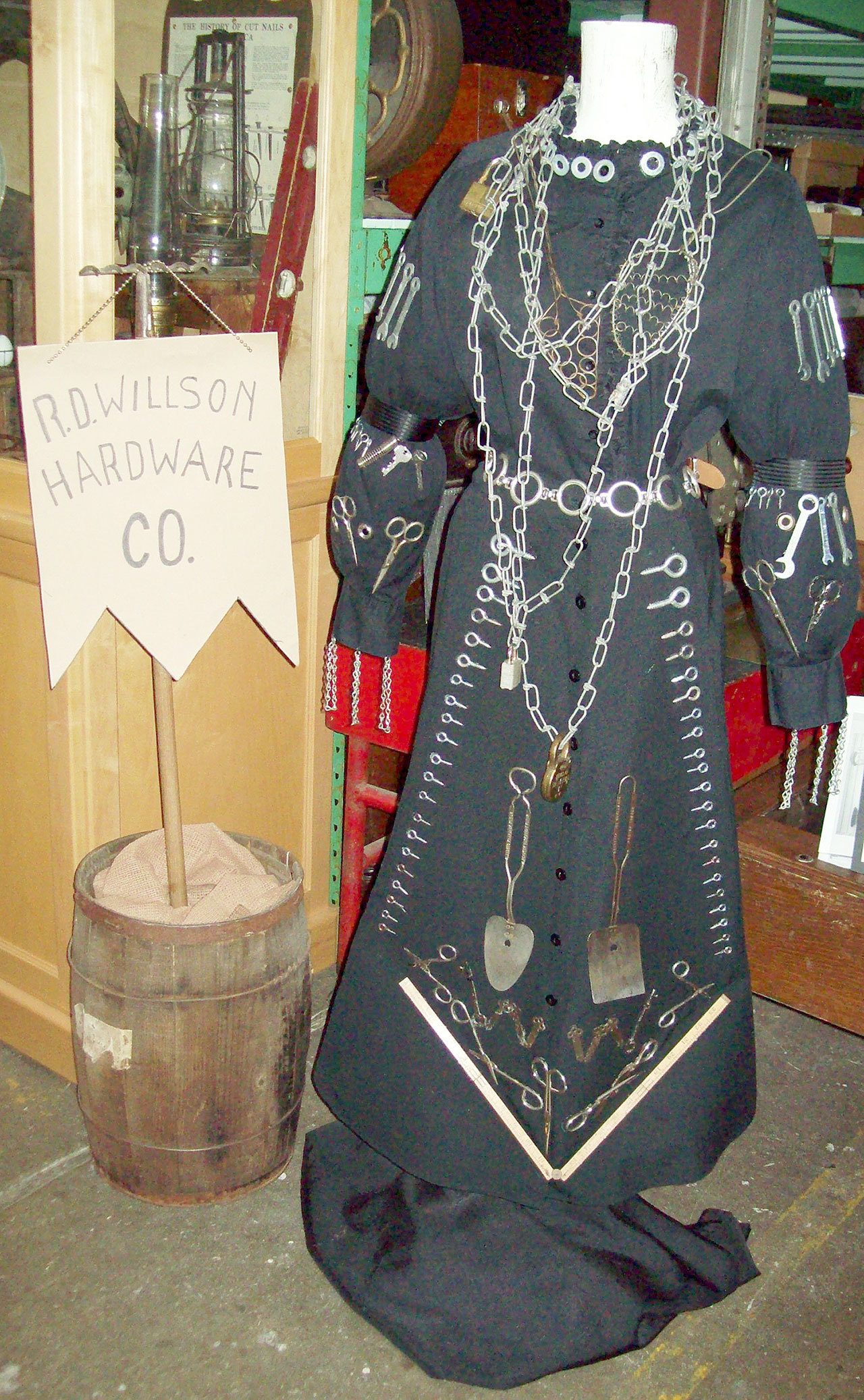 Clallam County Historical Society (3)                                The “Hardware Dress,” as worn by R.D. Willson’s daughter, Mary, in an advertisement for the Port Angeles store. At right, Janice Noonan re-created the “Hardware Dress” recently for the Clallam County Historical Society.