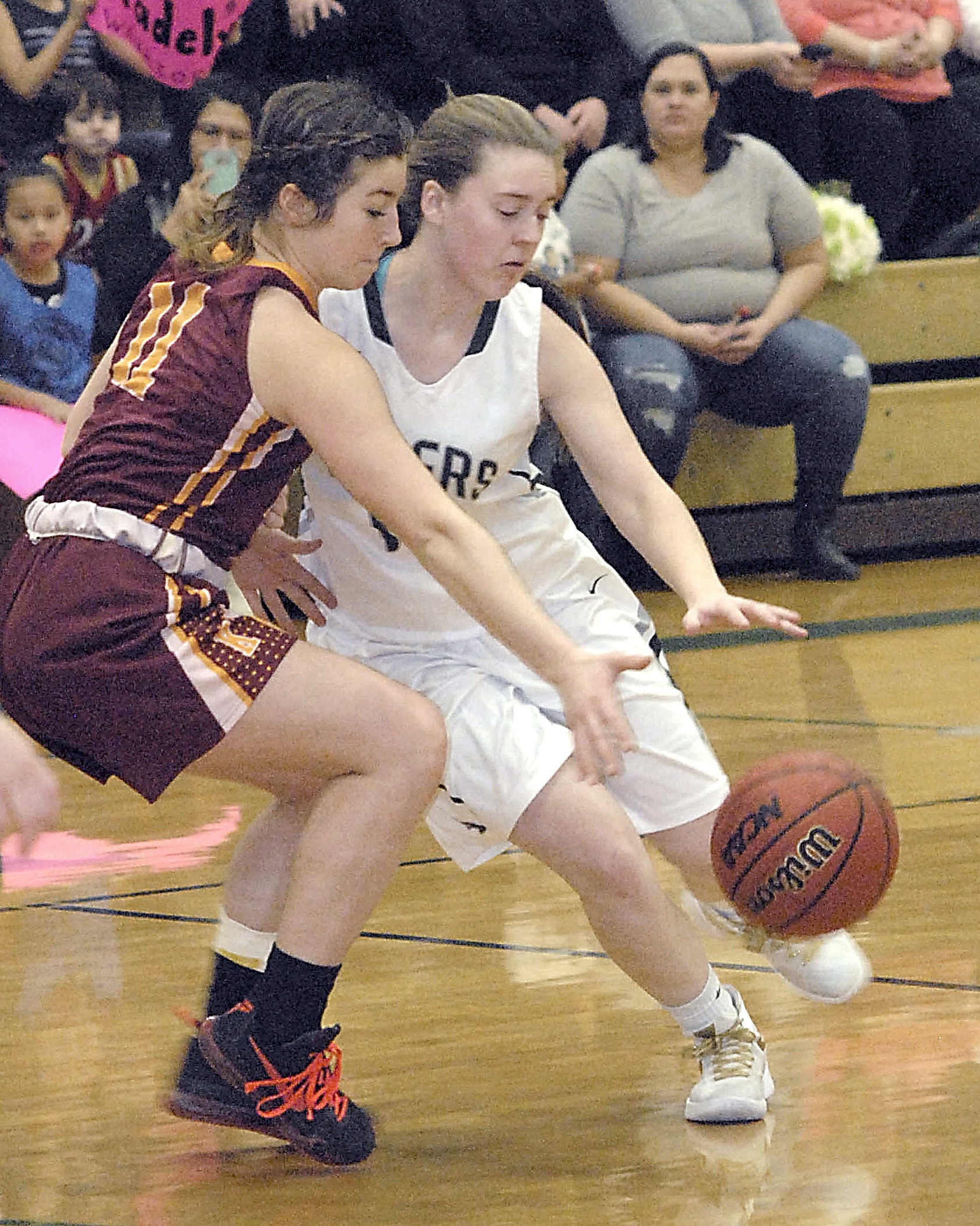 Keith Thorpe/Peninsula Daily News                                Port Angeles’ Lauren Lunt, right, and Kingston’s Emma Eliason compete for the ball during their Feb. 2 game at Port Angeles High School.