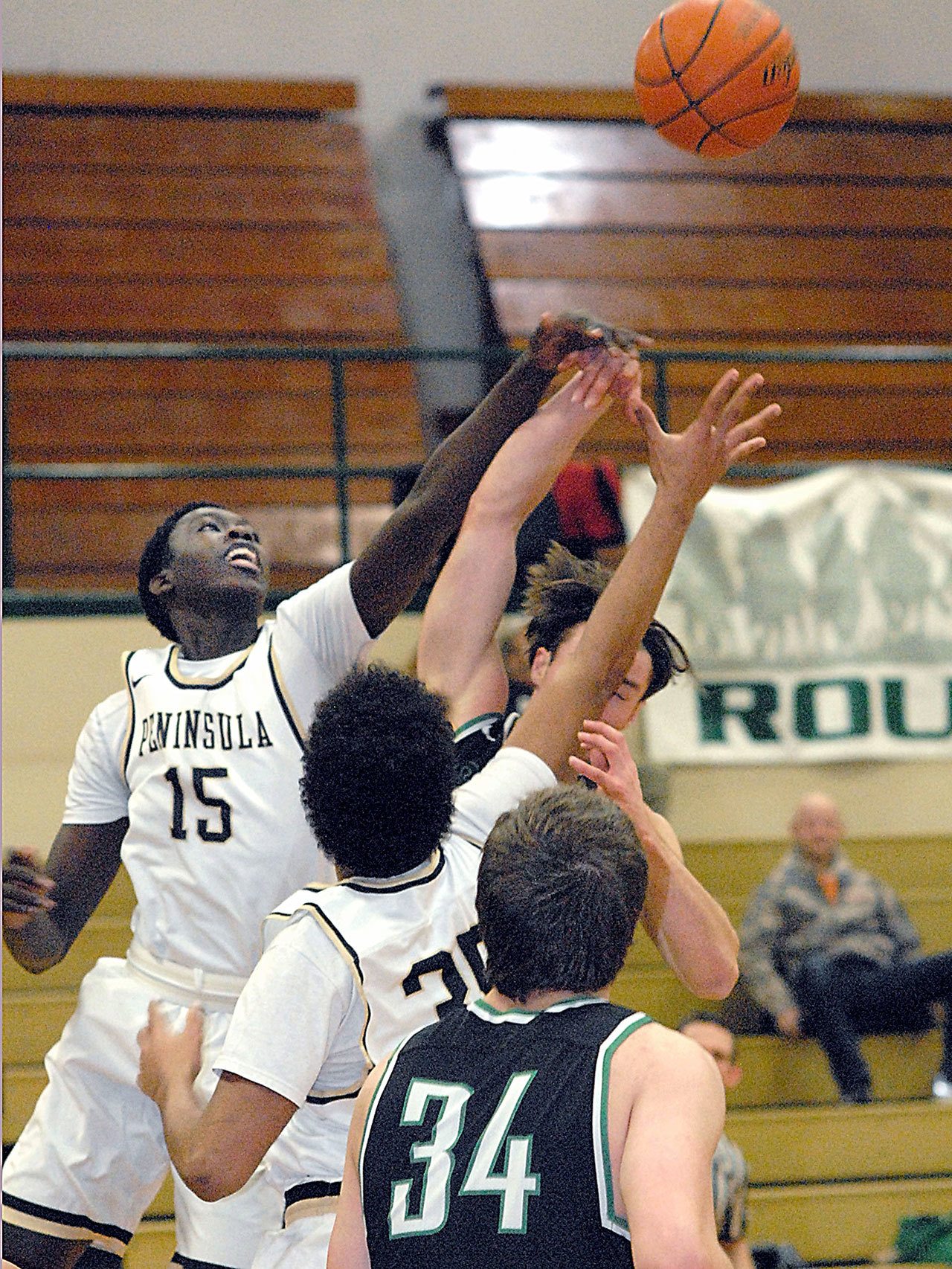 Keith Thorpe/Peninsula Daily News Peninsula’s Omar Lo, left and Sam Velez, center, vie for a rebound with Shoreline’s Ben Steinbrueck as Shoreline’s Jacob Perkins, front, looks on during the second quarter on Wednesday at Port Angeles High School.