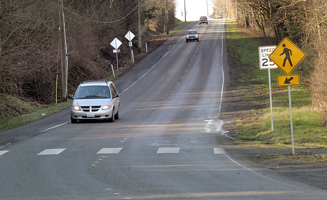 Vehicle traffic makes its way down Hill Street in Port Angeles, sharing the road with a connecting link of the Olympic Discovery Trail, designated as the shoulder of the roadway. (Keith Thorpe/Peninsula Daily News)