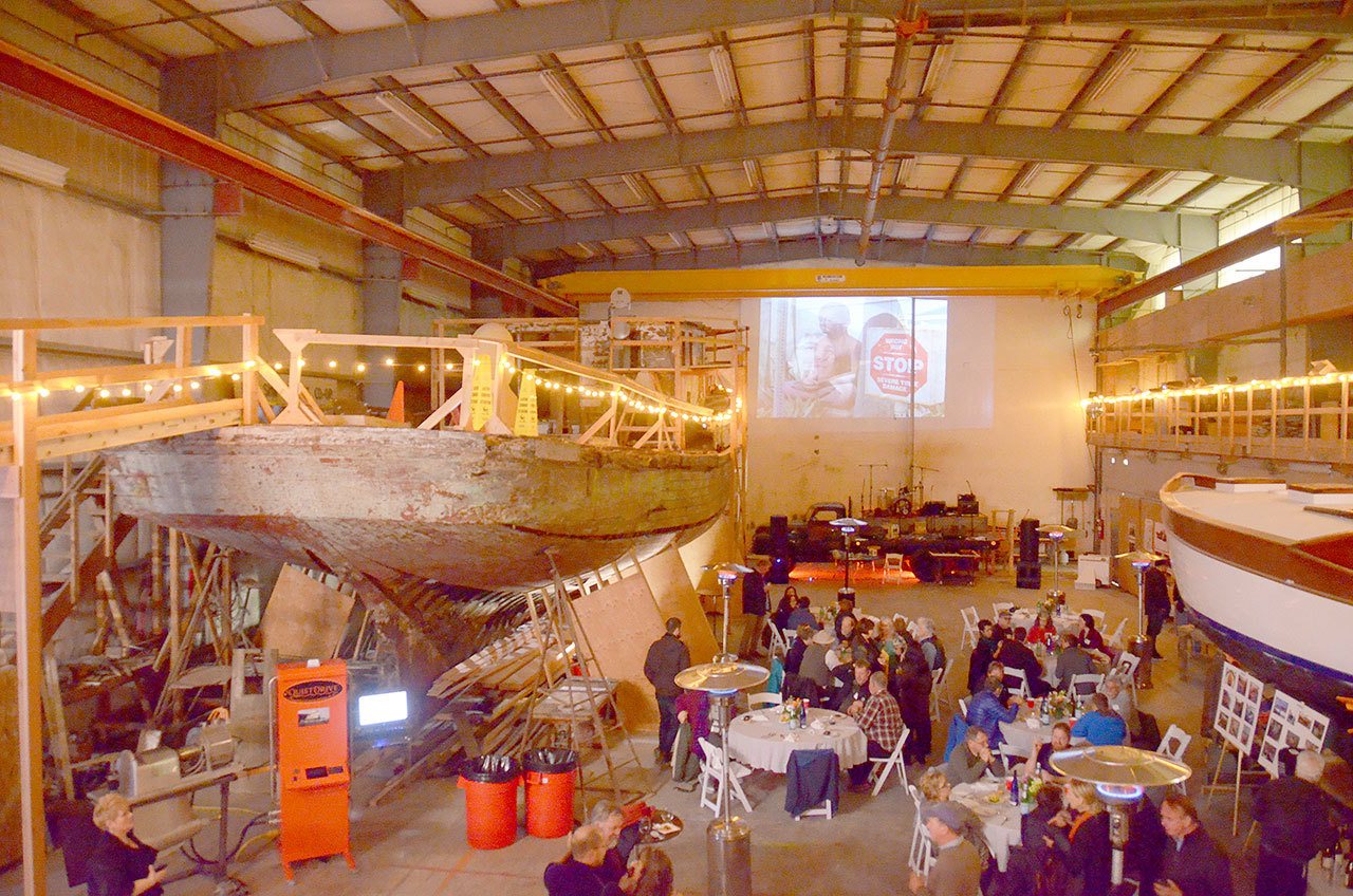 The Western Flyer, the boat made famous by author John Steinbeck, was decorated with lights during a Western Flyer Foundation event Saturday at Shipwrights Co-Op in Port Townsend. (Cydney McFarland/Peninsula Daily News)