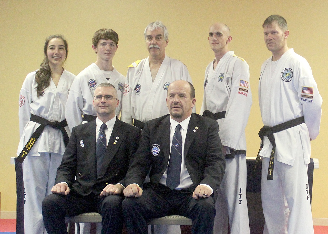 Bodystrong Taekwon-do of Sequim students, back row, from left, Jaden Rego, Trenton Phipps, John Golbeck, Troy Phipps and Larry Muckley completed black belt level testing. Front row, instructor Brandon Stoppani and examiner Master David Mason.