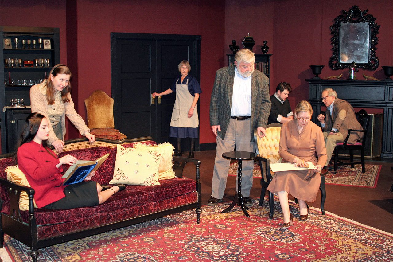 In foreground from left are Port Angeles Community Players Danielle Lorentzen, Sharah Truett, John Slevin and Lynne Murphy, with Cheri Trebon, Mark Lorentzen and George Wood in the back, in a scene from “The Haunting of Hill House,” which will stage in Port Angeles starting tonight. (Kate Carter/Port Angeles Community Players)