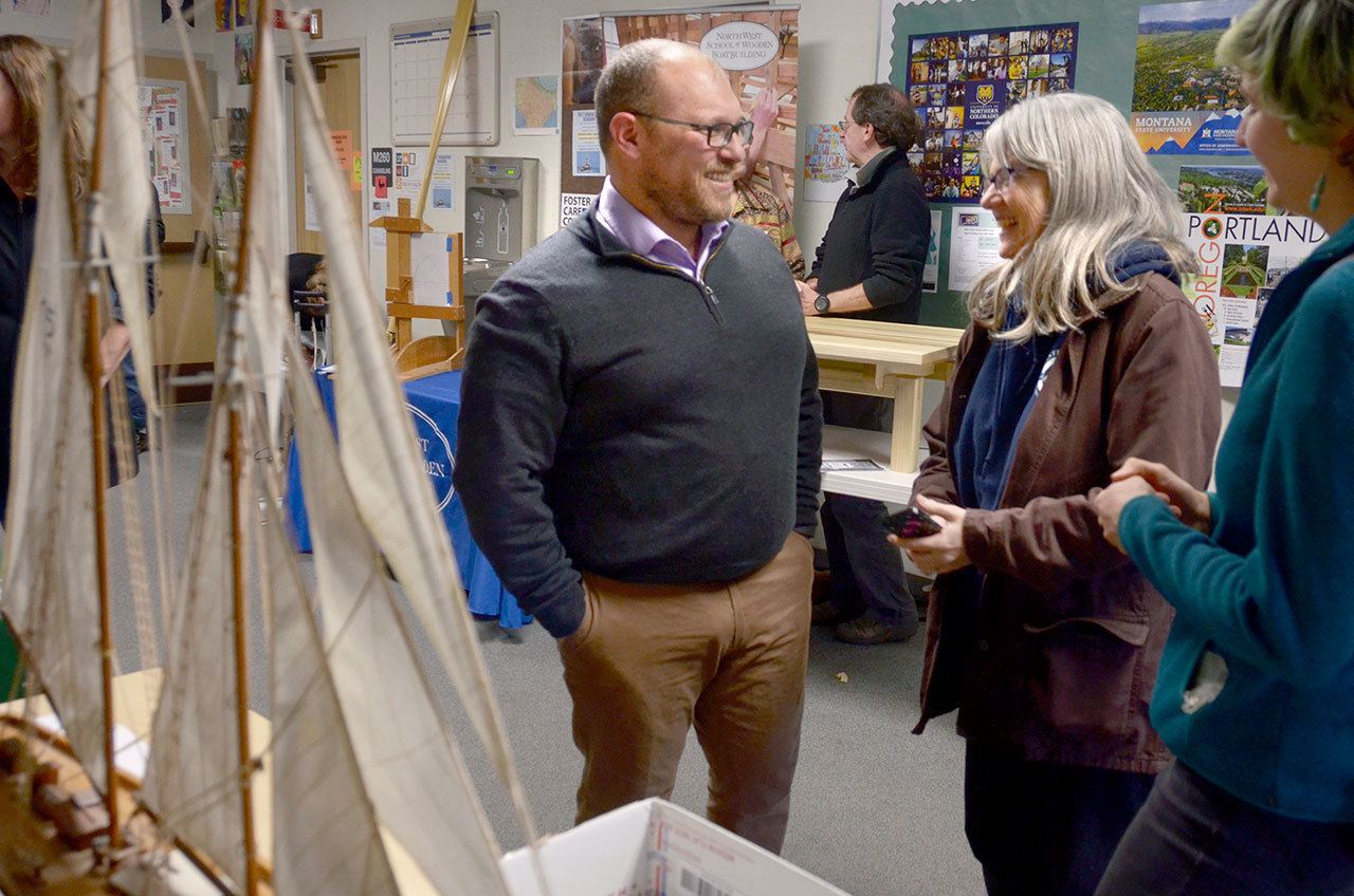 Joshua Berger, state lead for the maritime sector, speaks to Elizabeth Becker and Zoe Ballering from Sound Experience on Friday. Berger, Becker and Ballering were all at Port Townsend High School to discuss maritime career options with students. (Cydney McFarland/Peninsula Daily News)