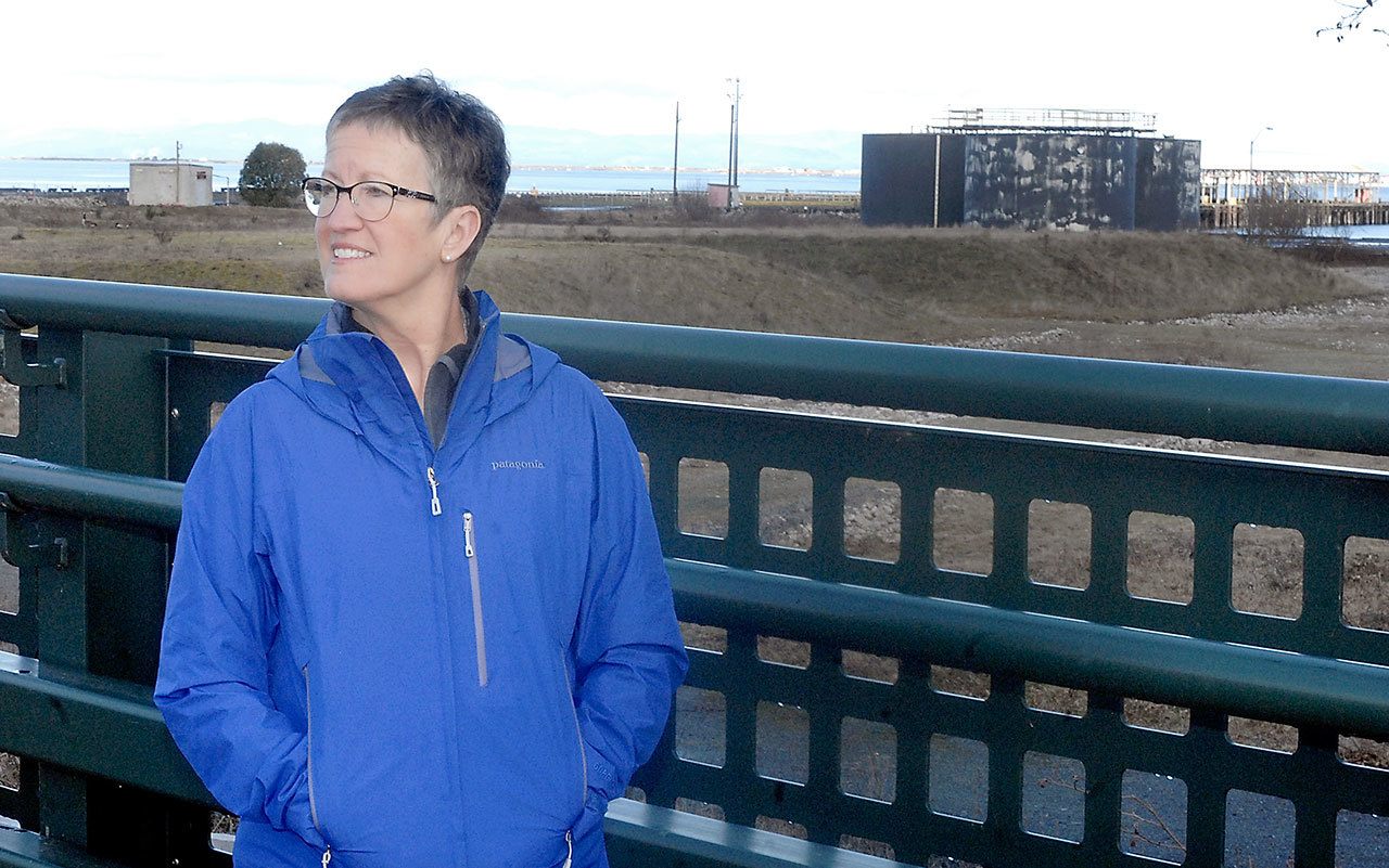 Deb Reed of Port Angeles visits the mostly vacant site of the former Rayioner pulp mill in Port Angeles, a place where she worked as a maintenance supervisor when the mill was shut down in 1997. (Keith Thorpe/Peninsula Daily News)