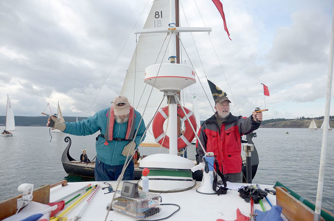 Race officers Dave Burrows and Myron Gauger track the wind direction in order to adjust the start line of the annual Shipwrights Regatta in Port Townsend Bay on Saturday. (Cydney McFarland/Peninsula Daily News)