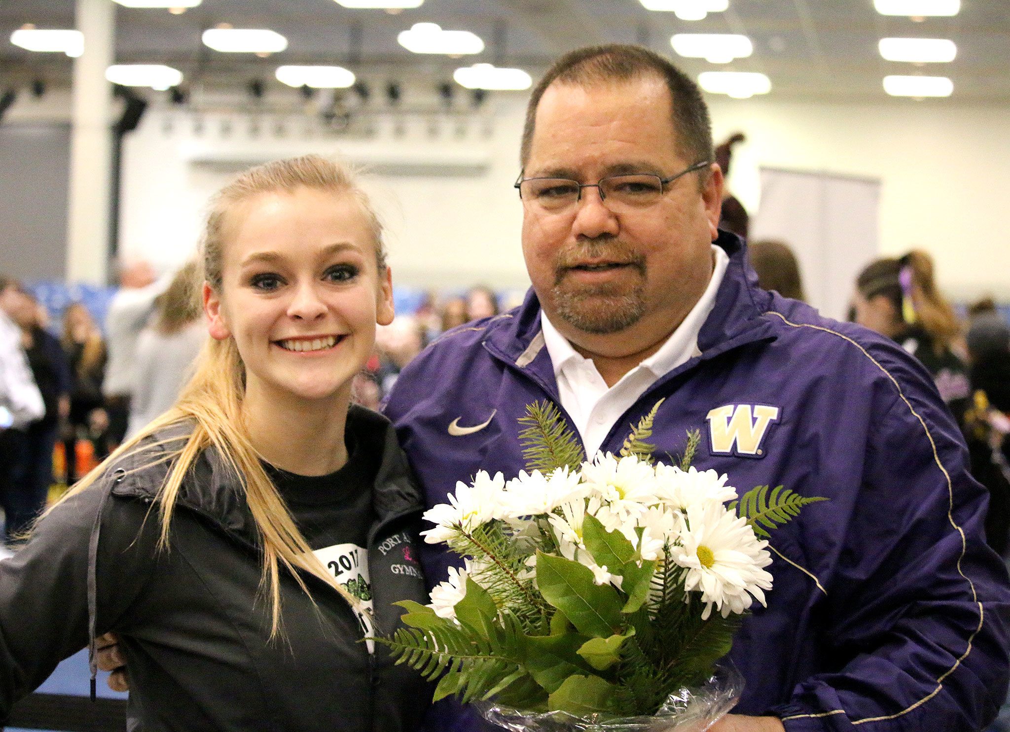 Port Angeles gymnast Laura Rooney and Port Angeles High School Athletic Director Dwayne Johnson at the WIAA 2A/3A State Gymnastics meet at the Tacoma Dome earlier this month.