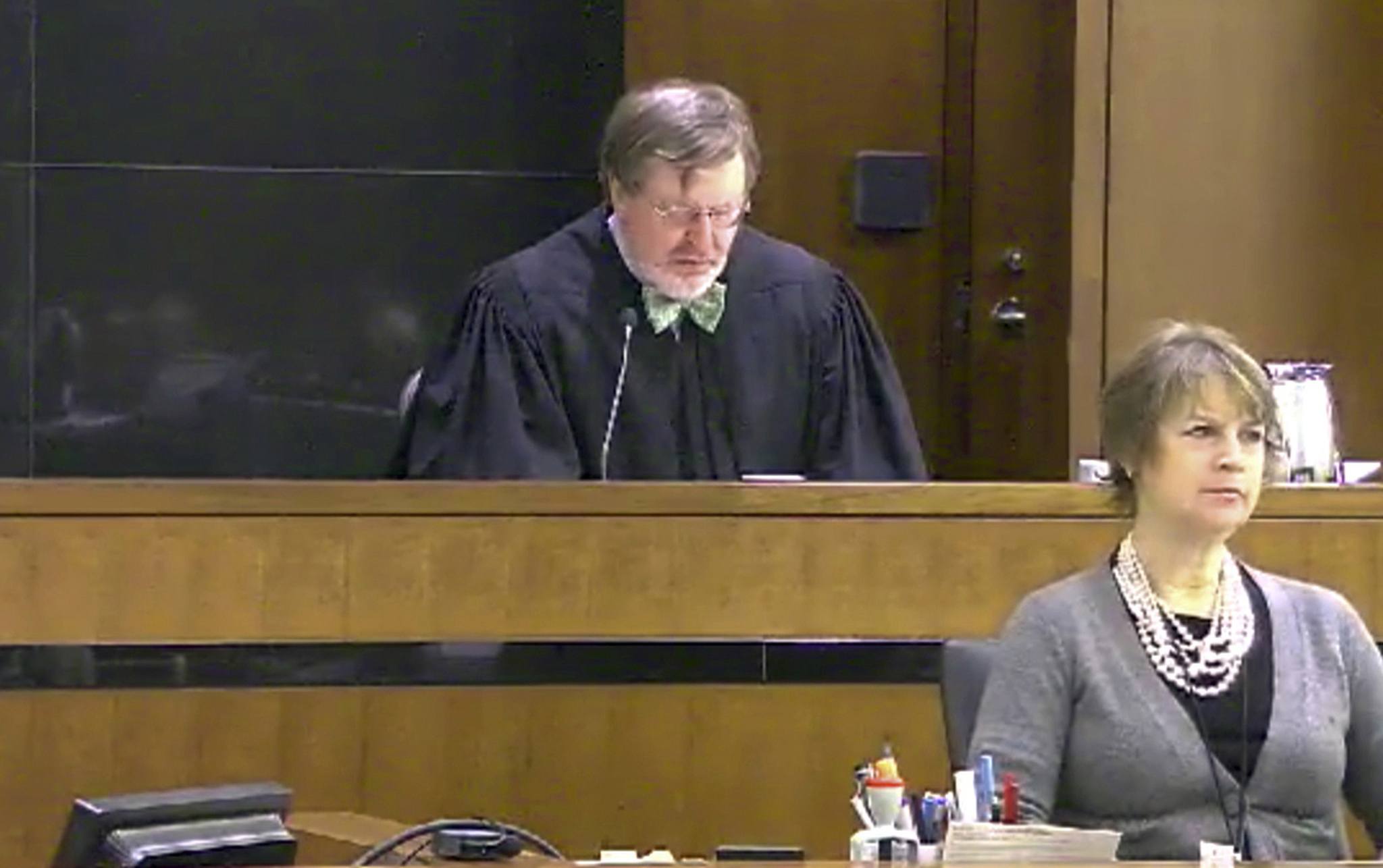 This March 12, 2013, still image taken from United States Courts shows Judge James Robart listening to a case at Seattle Courthouse in Seattle. (United States Courts via AP)