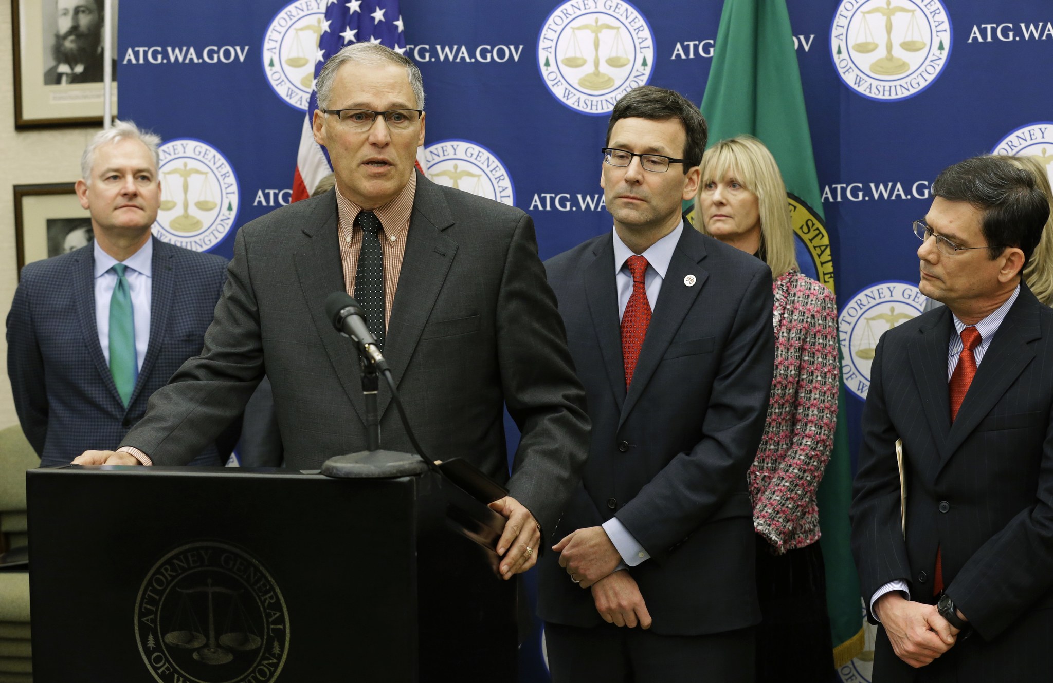 In this Jan. 16, 2017, photo, Washington Gov. Jay Inslee, second from left, speaks during a news conference at the Capitol in Olympia to announce that he and Attorney General Bob Ferguson, third from left, have proposed legislation to abolish the death penalty in Washington state. (Ted S. Warren/The Associated Press)