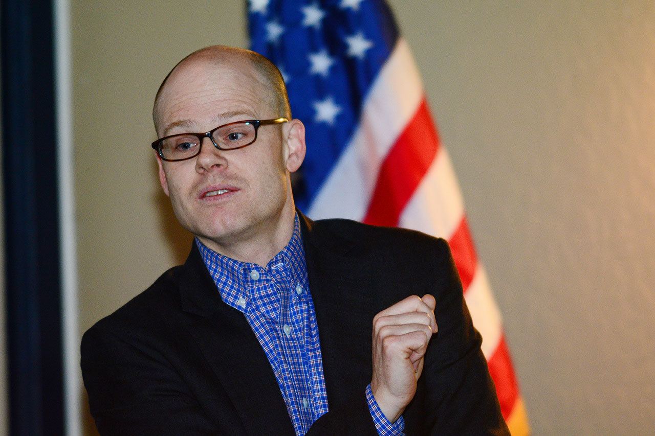 Clallam County Health Officer Chris Frank tells more than 30 people who attended the recent Port Angeles Citizens Action Network forum that the county’s harm reduction efforts, such as the syringe exchange and distribution of naloxone, prevents the spread of disease and saves lives. (Jesse Major/Peninsula Daily News)