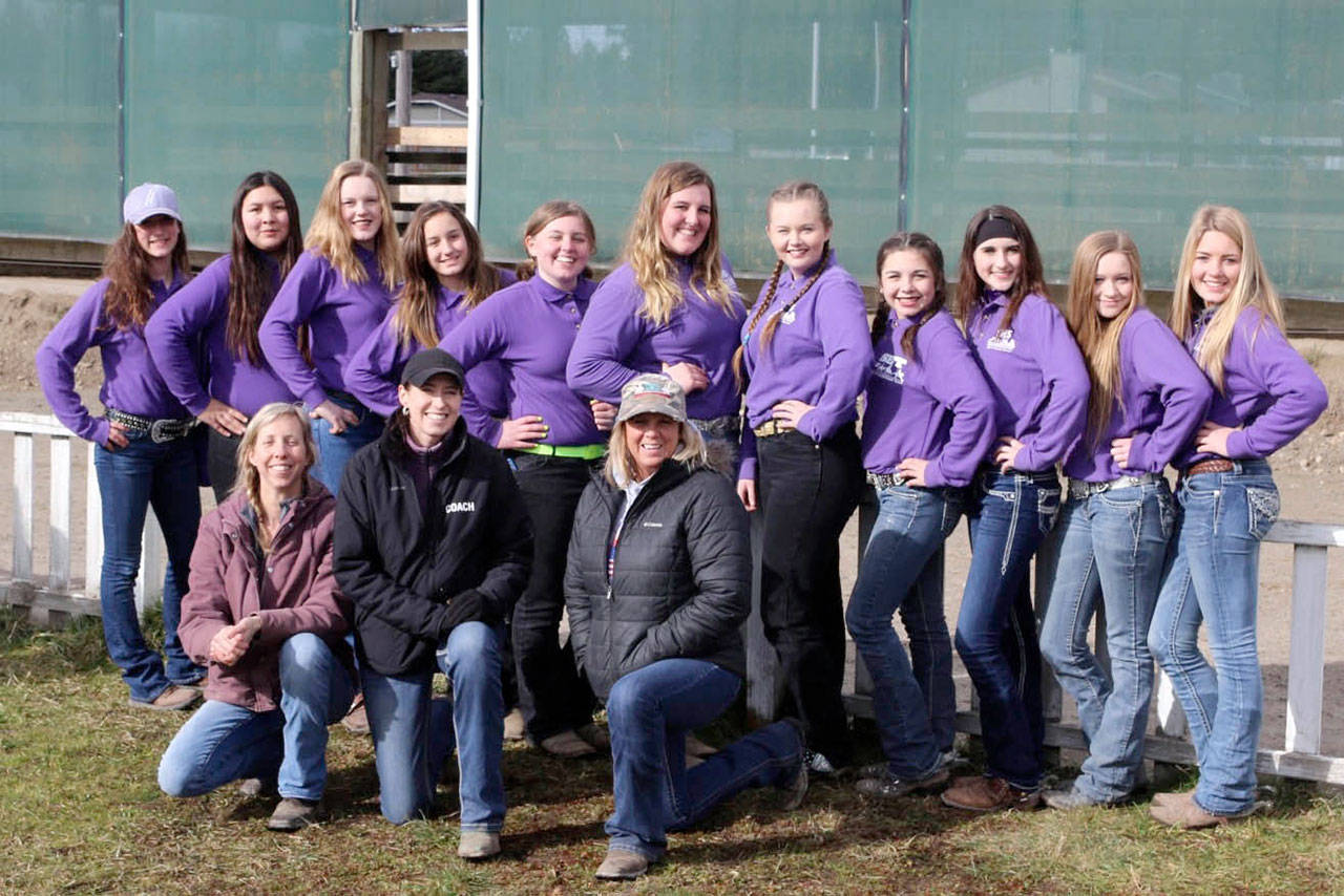 Sequim’s high school equestrian team has one more qualifying match to go before the Washington State High School Equestrian Team state finals in April. The team is, in back from left, Yana Hoesel, Lilly Thomas, Emelie Furste, Grace Niemeyer, Madi Murphy, Amanda Murphy, Amy Tucker, Miranda Williams, Sydney Balkan, Abi Payseno and Cristina Williams; and, in front from left, games coach Betina Hoesel, head coach Katie Salmon-Newton and performance coach Kristin Eshom.