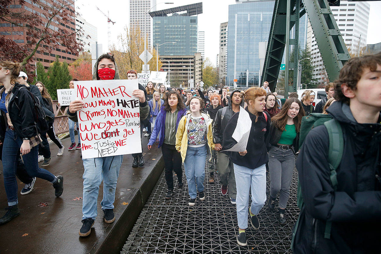 In this Nov. 14, 2016, photo, Portland (Ore.) Public School students walk out of schools and converge on Pioneer Courthouse Square for a protest against the results of the previous week’s presidential election. (Beth Nakamura/The Oregonian via AP)