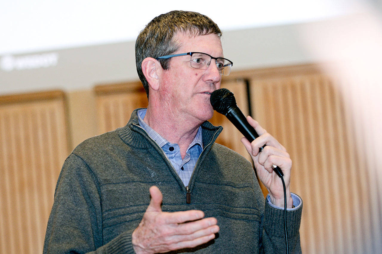 John Wynands, regional administrator for the state Department of Transportation, tells a group in Forks on Tuesday the agency has started designing a new Elwha River bridge for U.S. Highway 101 that would be on a new alignment. (Jesse Major/Peninsula Daily News)