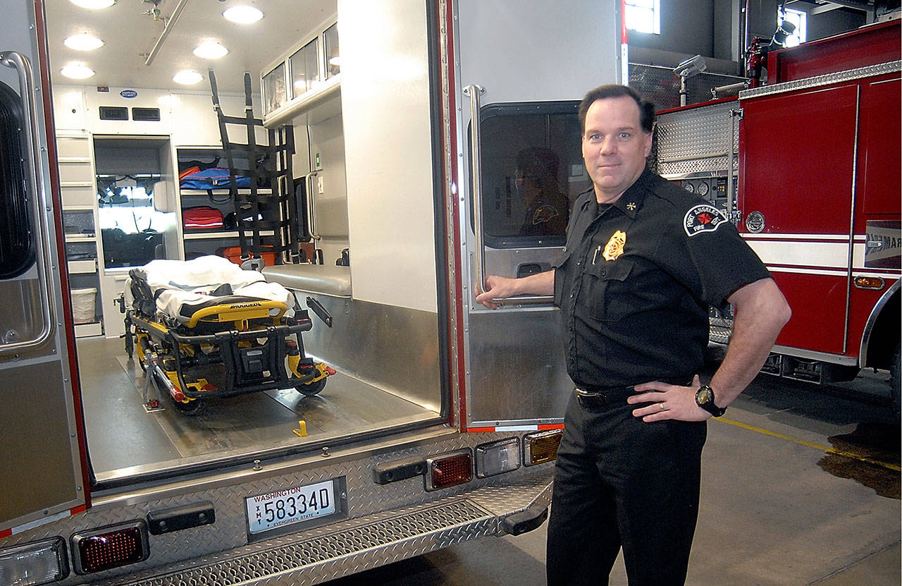 Port Angeles Assistant Fire Chief Mike Sanders shows the interior of one of his department’s paramedic units on Thursday at the Port Angeles Fire Hall. (Keith Thorpe/Peninsula Daily News)