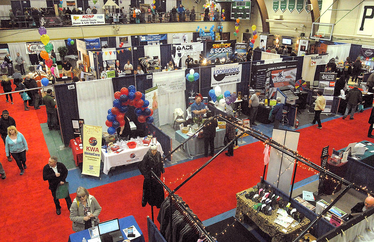 Visitors look at booths at the 2016 Clallam County Home & Lifestyle Show. (Keith Thorpe/Peninsula Daily News)