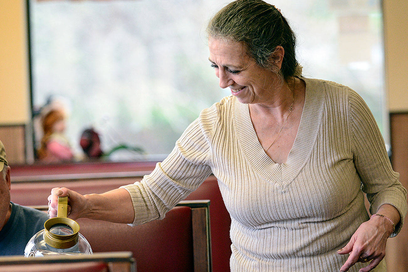 Joyce cafe owner putting away donation jar after burglaries