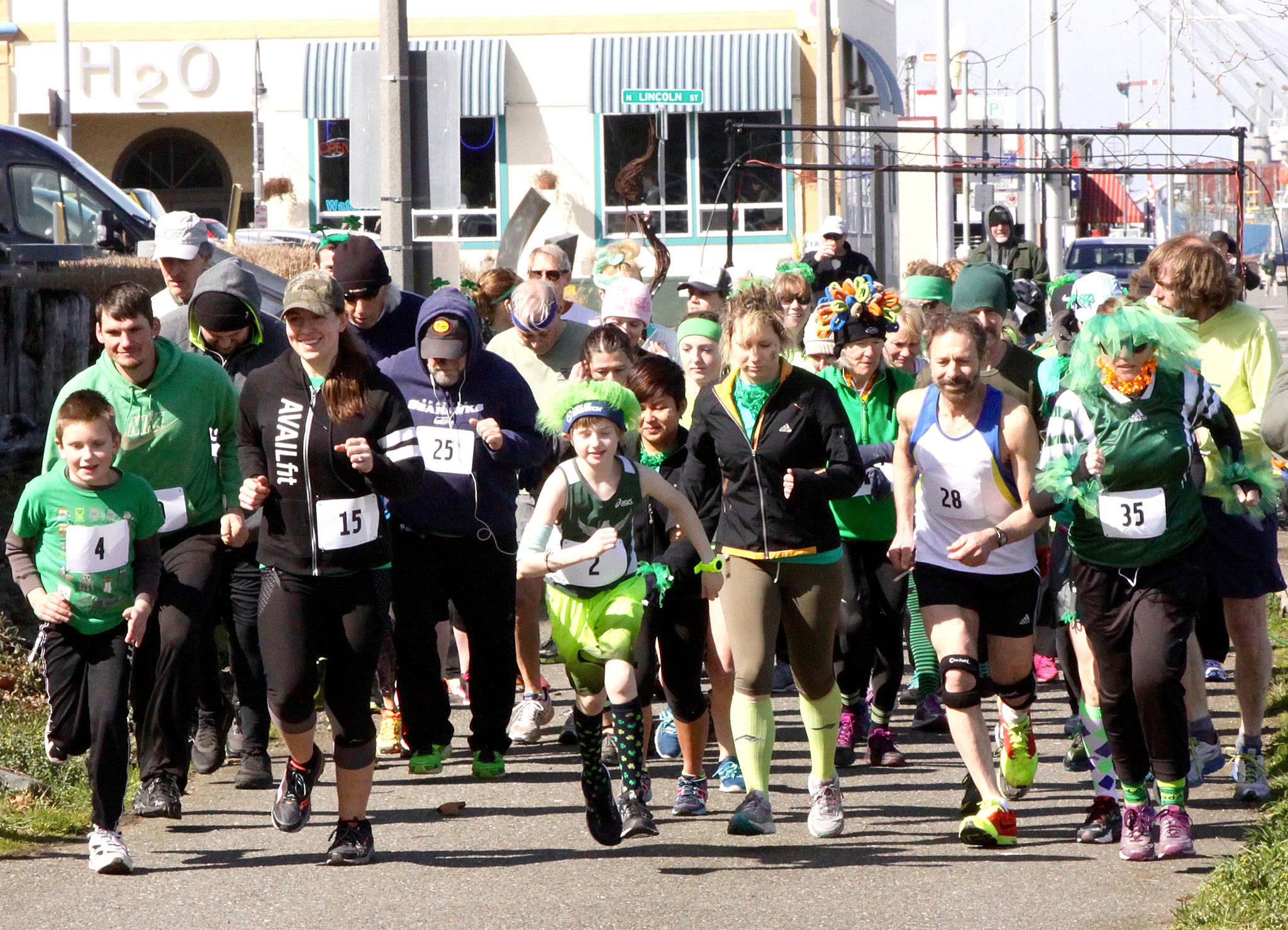 Dave Logan/for Peninsula Daily News                                They’re off and running at the annual St. Patrick’s Day Fun Run, sponsored by the Port Angeles Parks and Recreation Department. Justover 50 peoplew and a dog ran the 5K course along the Port Angeles waterfront starting at the City Pier. It was a cold and windy runbut the effort of running kept them warm. From left, are Zeke Gould (4), Mike Gould (10), Leah Gould (15), David Doran (25), EastonDempsey (2), winner Dave Lasorsa (28) and Ginny Sturgeon (35).