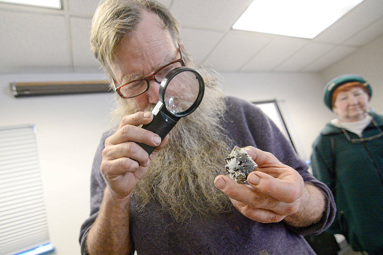 Russell Boggs helps rockhounds identify their “mystery” rocks during the Port Angeles Parks and Recreation Department’s seventh annual Rock, Gem & Jewelry Show on Sunday. (Jesse Major/Peninsula Daily News)