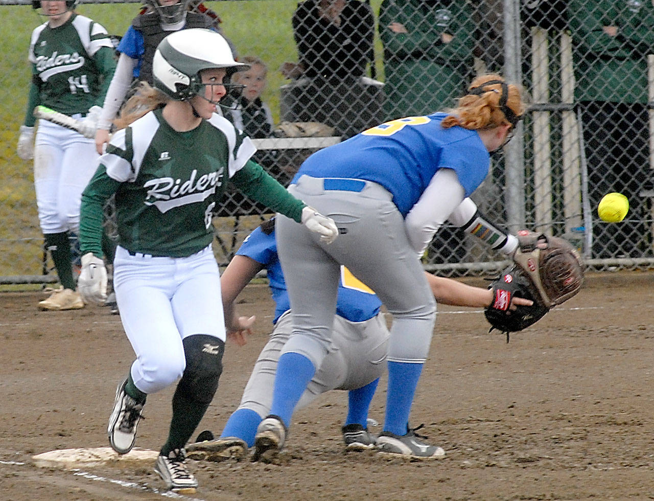 Keith Thorpe/Peninsula Daily News                                Port Angeles’ Sierra Robinson beats the throw to Bremerton first baseman Cyrah Bias backed by second baseman Lissa Joiner, right, in the first inning of the Roughriders’ 12-0 shutout of the Knights.