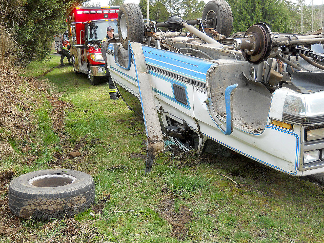 A Chevrolet Silverado traveling north on state Highway 19 near milepost 3 on Saturday afternoon lost a wheel and rolled over. (Port Ludlow Fire & Rescue)