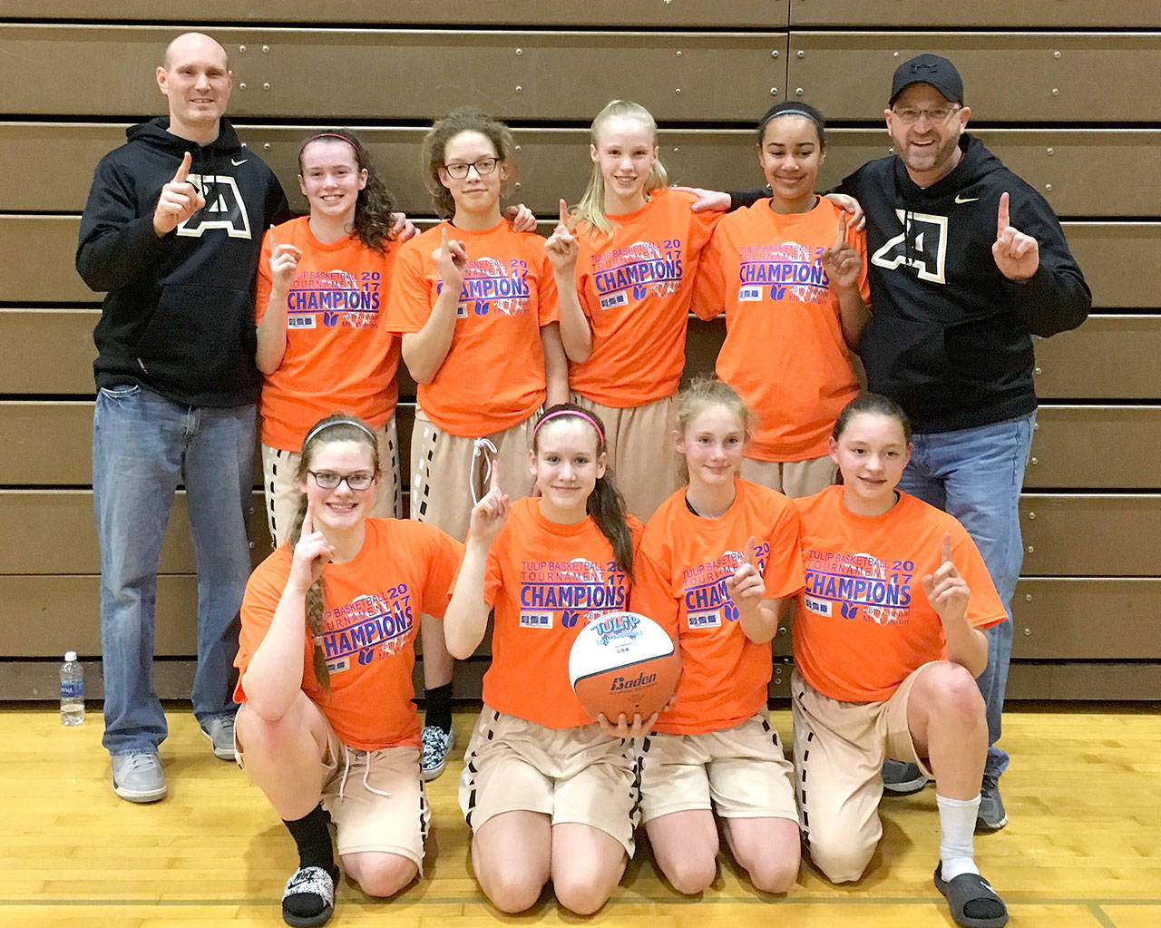 The Olympic Avalanche Black eighth-grade girls won the 25th annual Tulip Tournament this weekend. From left, back row, are assistant coach Kenton Long, Jaida Wood, MJ Cooke, Maggie Ruddell, Jayla Julmist and head coach Joe Marvelle. From left, front row, are Myra Gale Walker, Hannah Reetz, Emilia Long, Jada Cargo-Acosta.