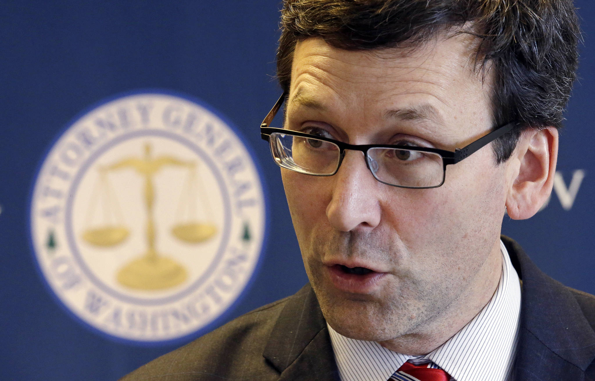 Washington State Attorney General Bob Ferguson speaks about President Trump’s new executive order at a news conference Monday in Seattle. (Elaine Thompson/The Associated Press)