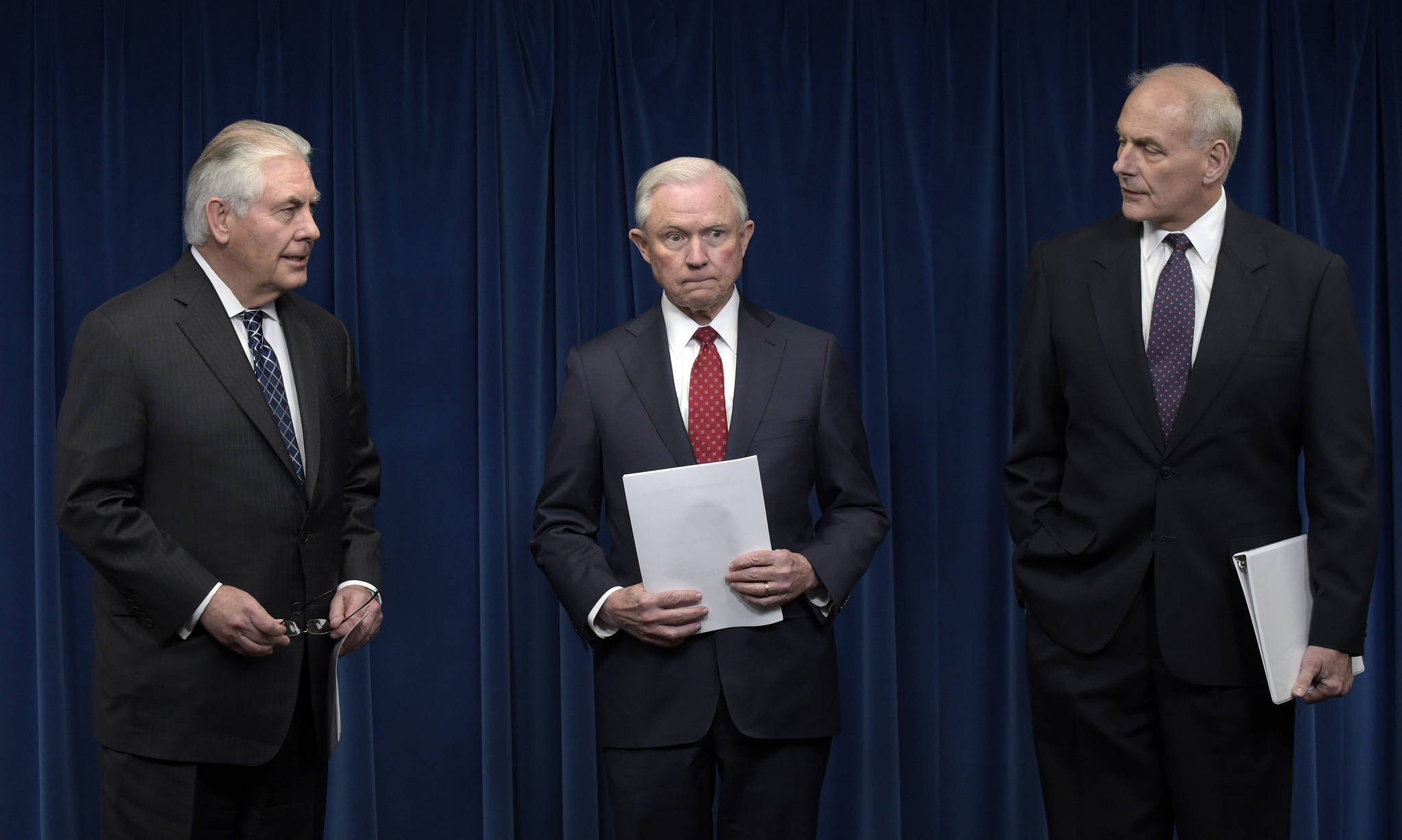 From left, Secretary of State Rex Tillerson, Attorney General Jeff Sessions and Homeland Security Secretary John Kelly arrive for a news conference at the U.S. Customs and Border Protection office Monday to make statements on issues related to visas and travel. (Susan Walsh/The Associated Press)