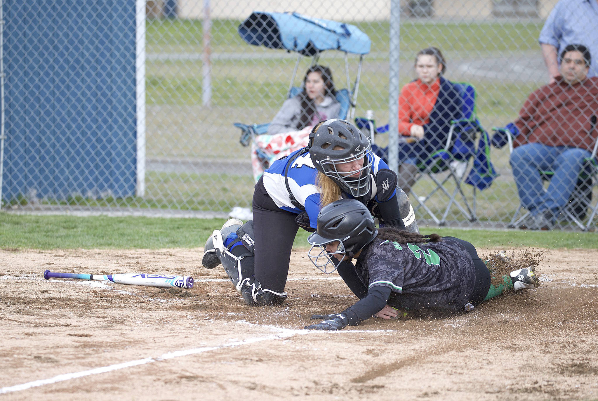 Steve Mullensky/for Peninsula Daily News                                Chimacum’s Mechelle Nisbet tags out Klahowya’s Hannah Bastian at home plate during the Cowboys’ 5-4 win Friday.