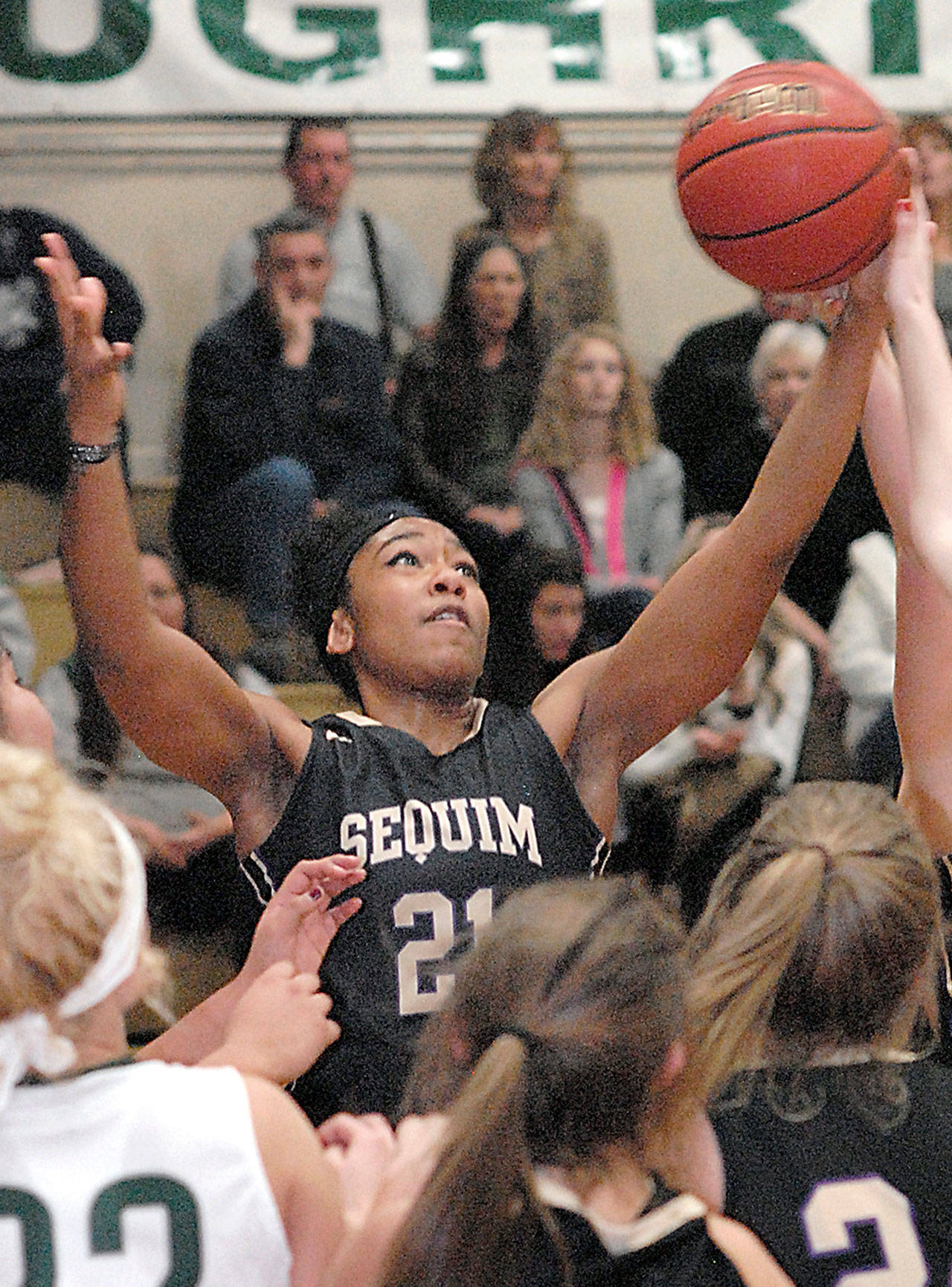 Keith Thorpe/Peninsula Daily News Sequim’s Adrienne Haggerty, top, pulls down a rebound in the fourth quarter on Friday while surrounded by, from left, Nizhoni Wheeler and Natalie Steinman of Port Angeles and teammates Bobbi Sparks and Madison Green.